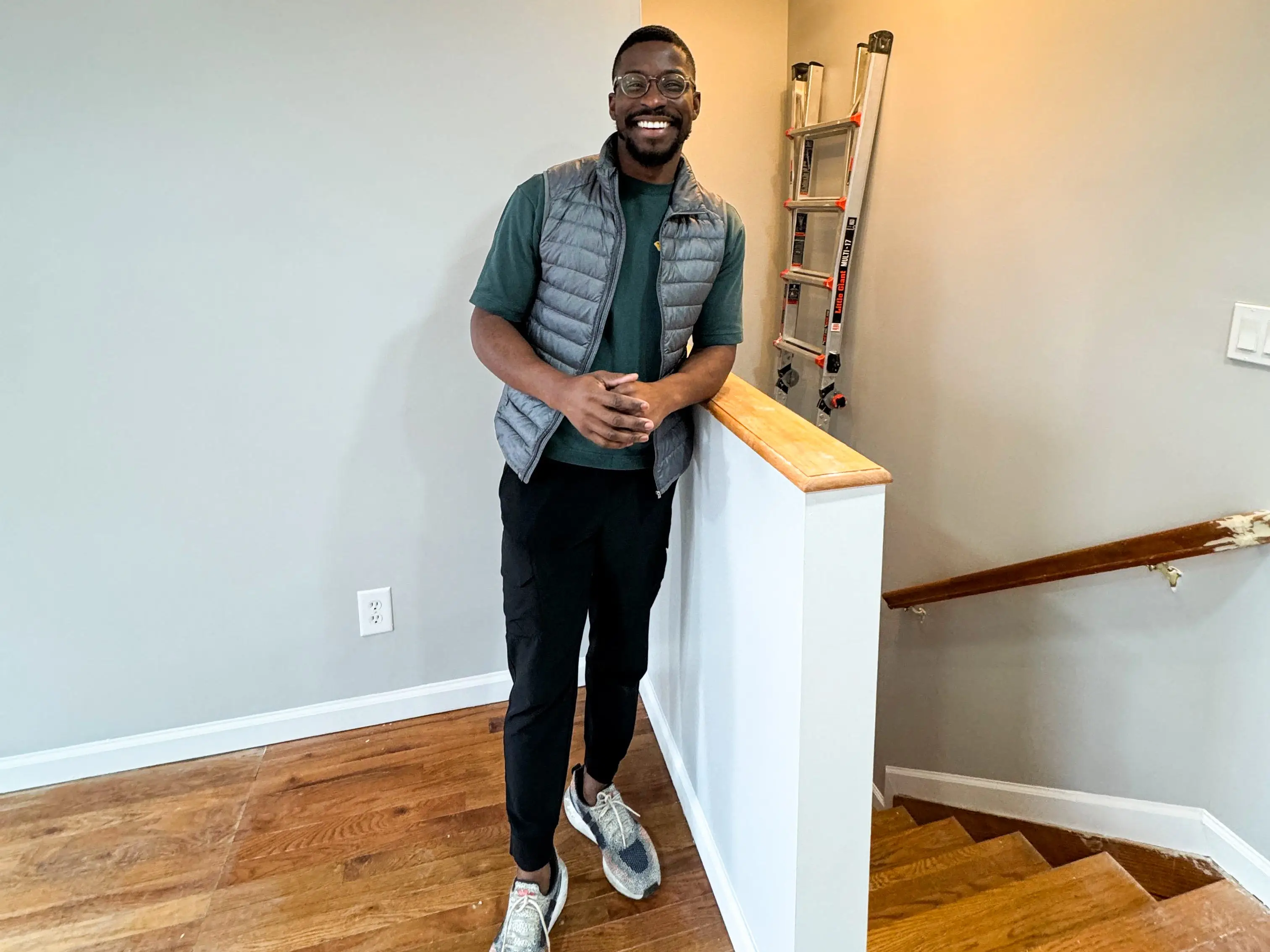 Isreal Adeyanju standing next to a stairwell.
