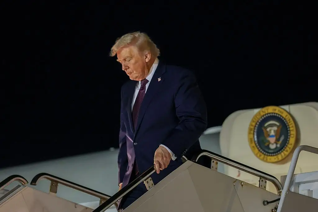 Donald Trump disembarks Air Force One in Palm Beach.