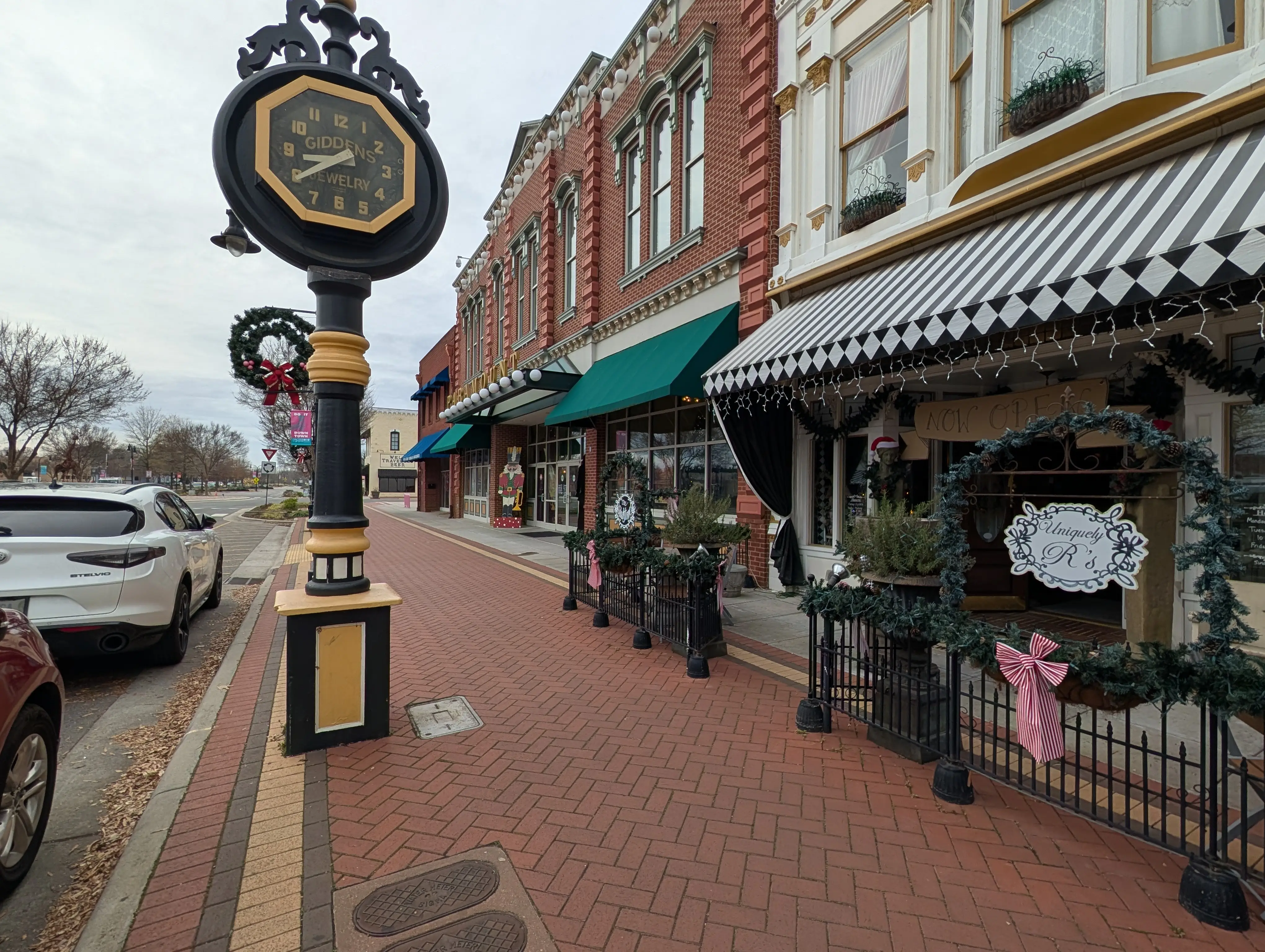 A main street downtown decorated for christmas.