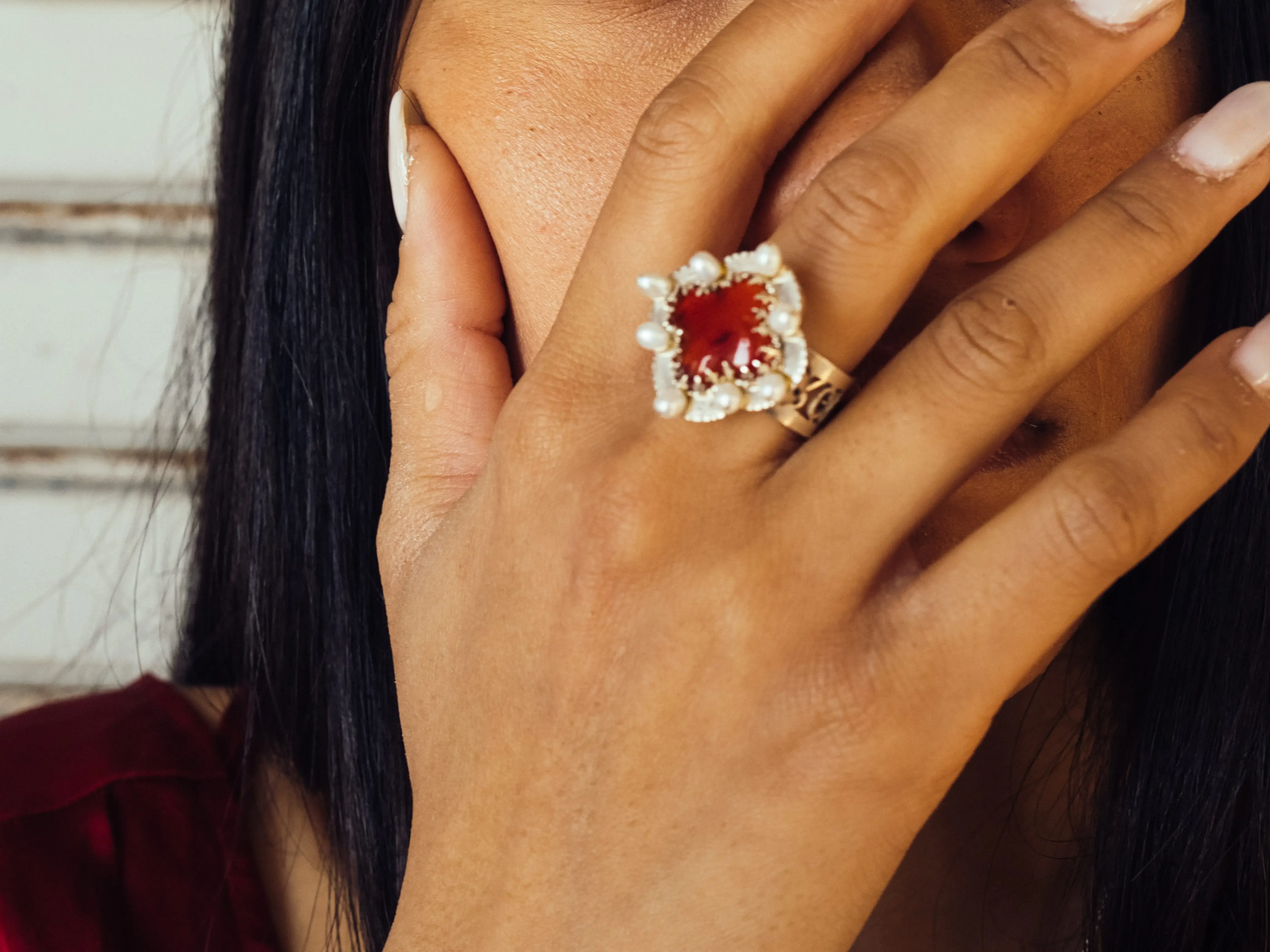 A woman with a big gemstone ring.