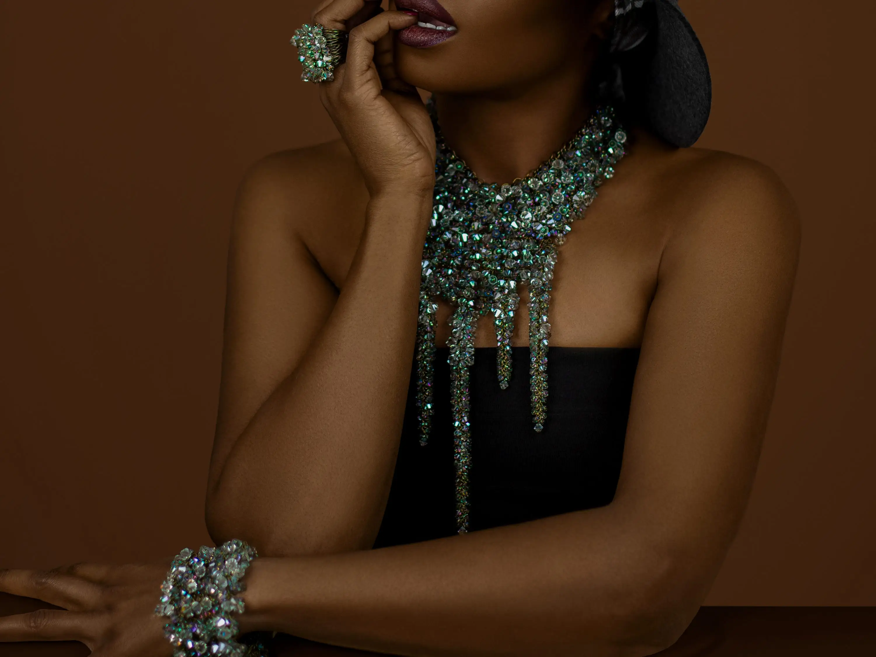 A woman with a beaded bracelet and necklace.