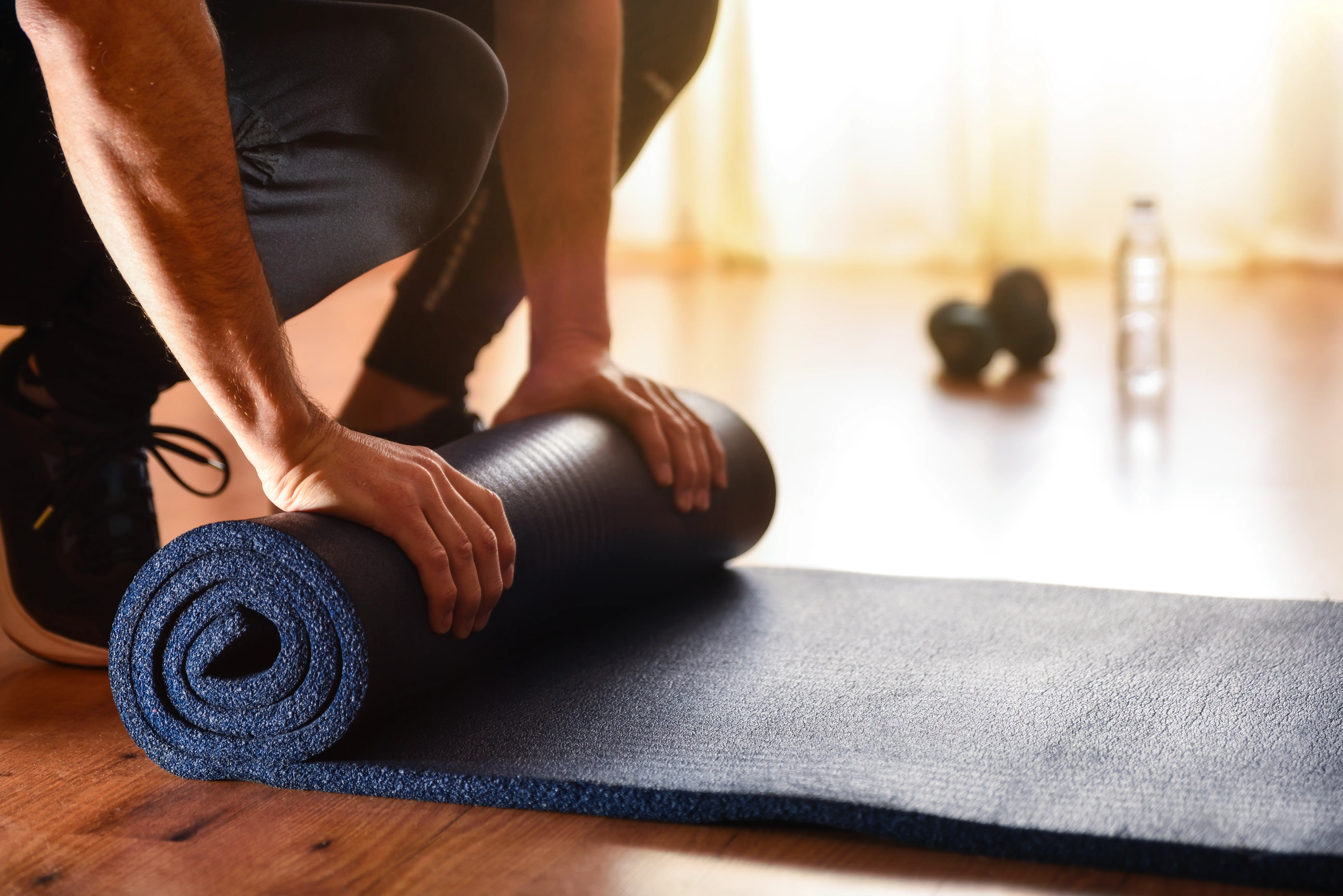 rolling up a yoga mat