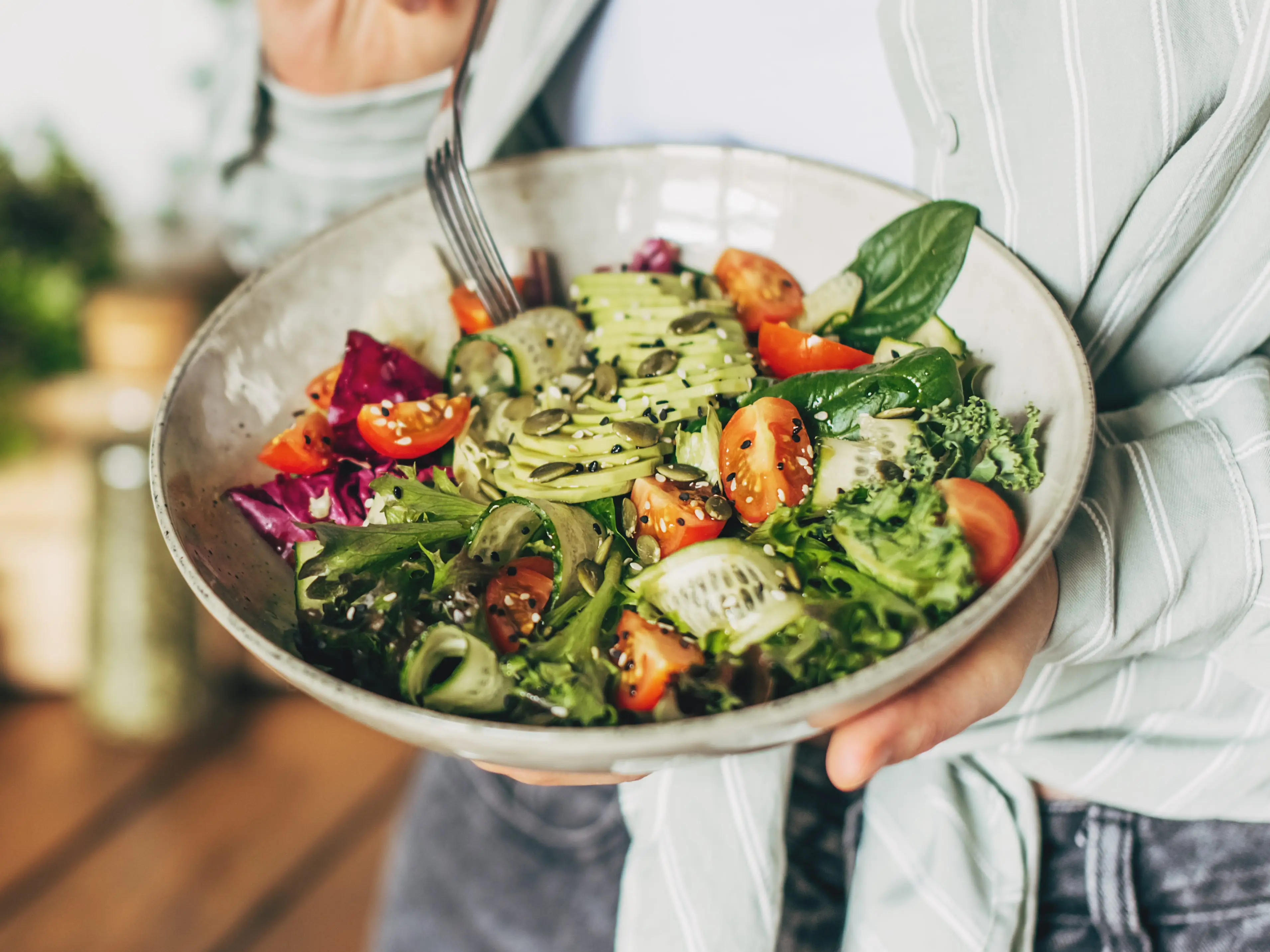 Woman eating salad