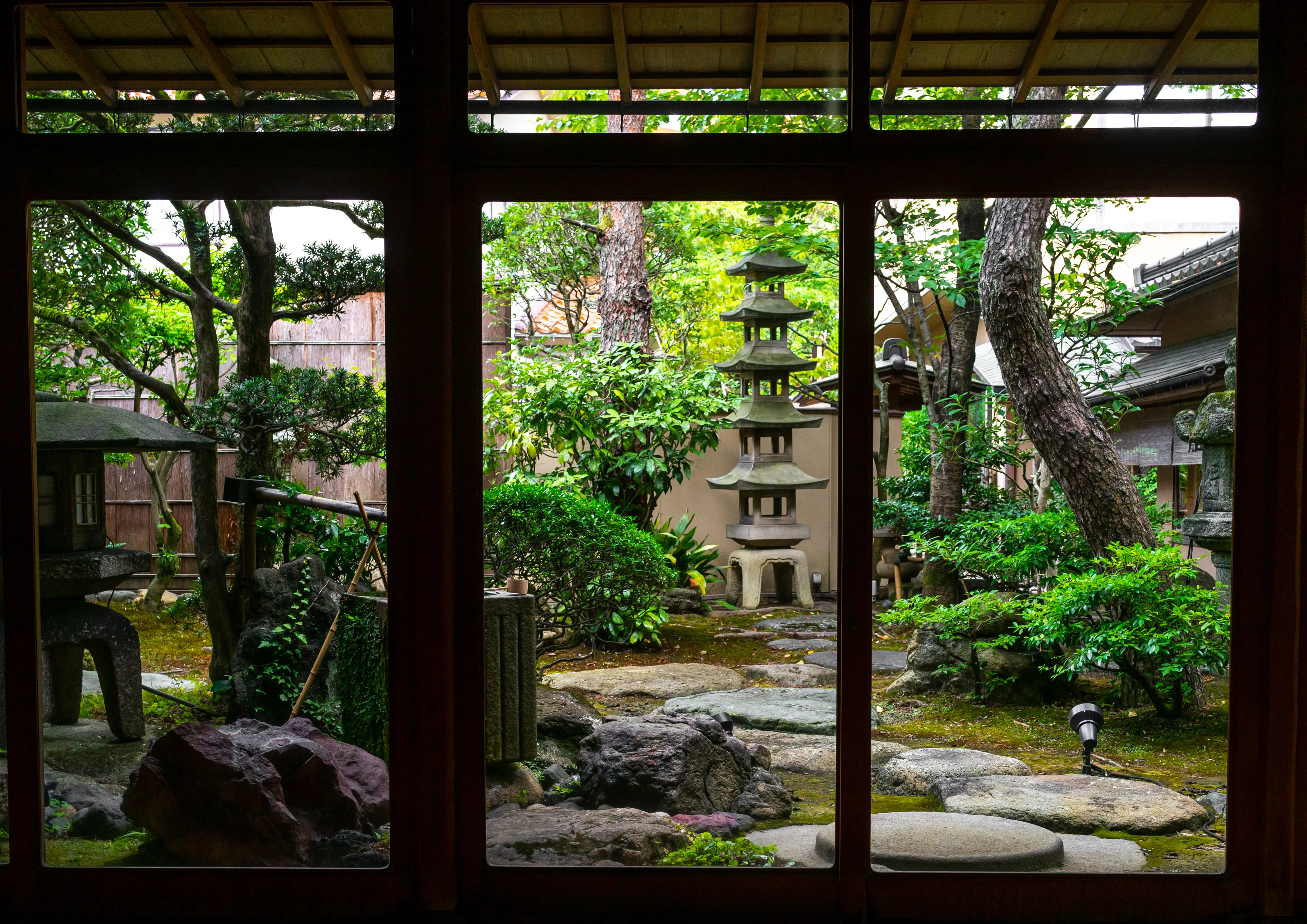 Japanese garden as seen through a window.