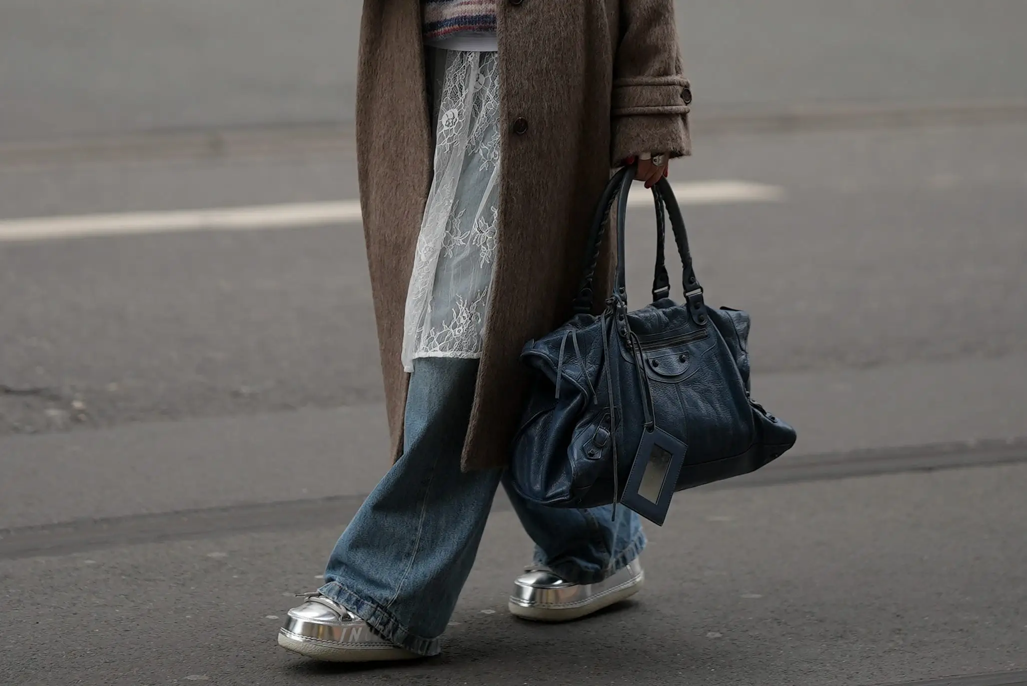 Woman holding Balenciaga bag