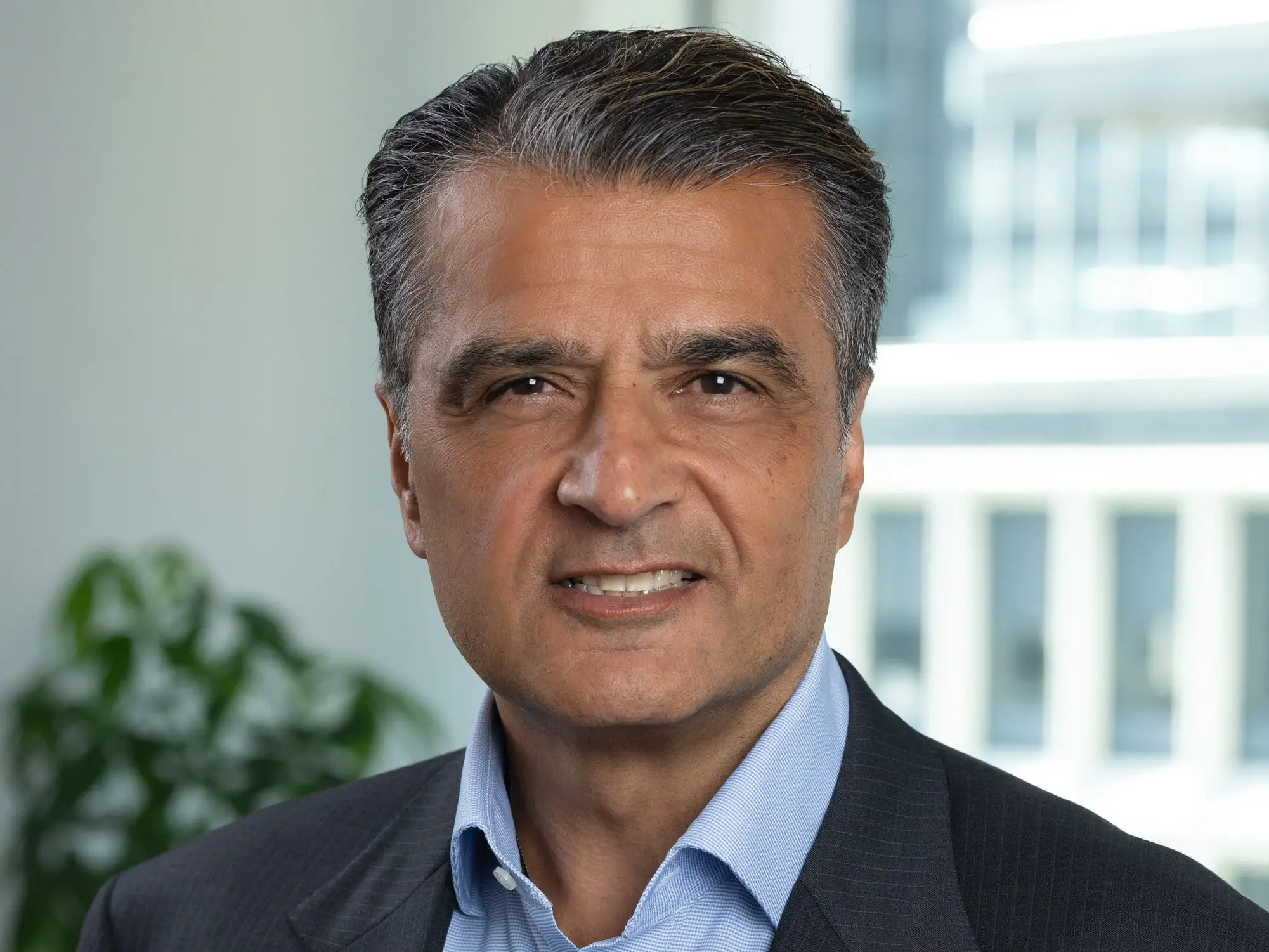 Ravi Singh smiles in a corporate partnership