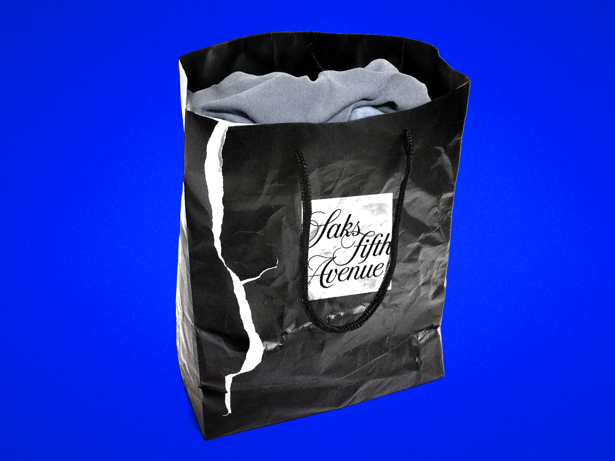 Torn Black Saks Fifth Avenue Shopping Bag.