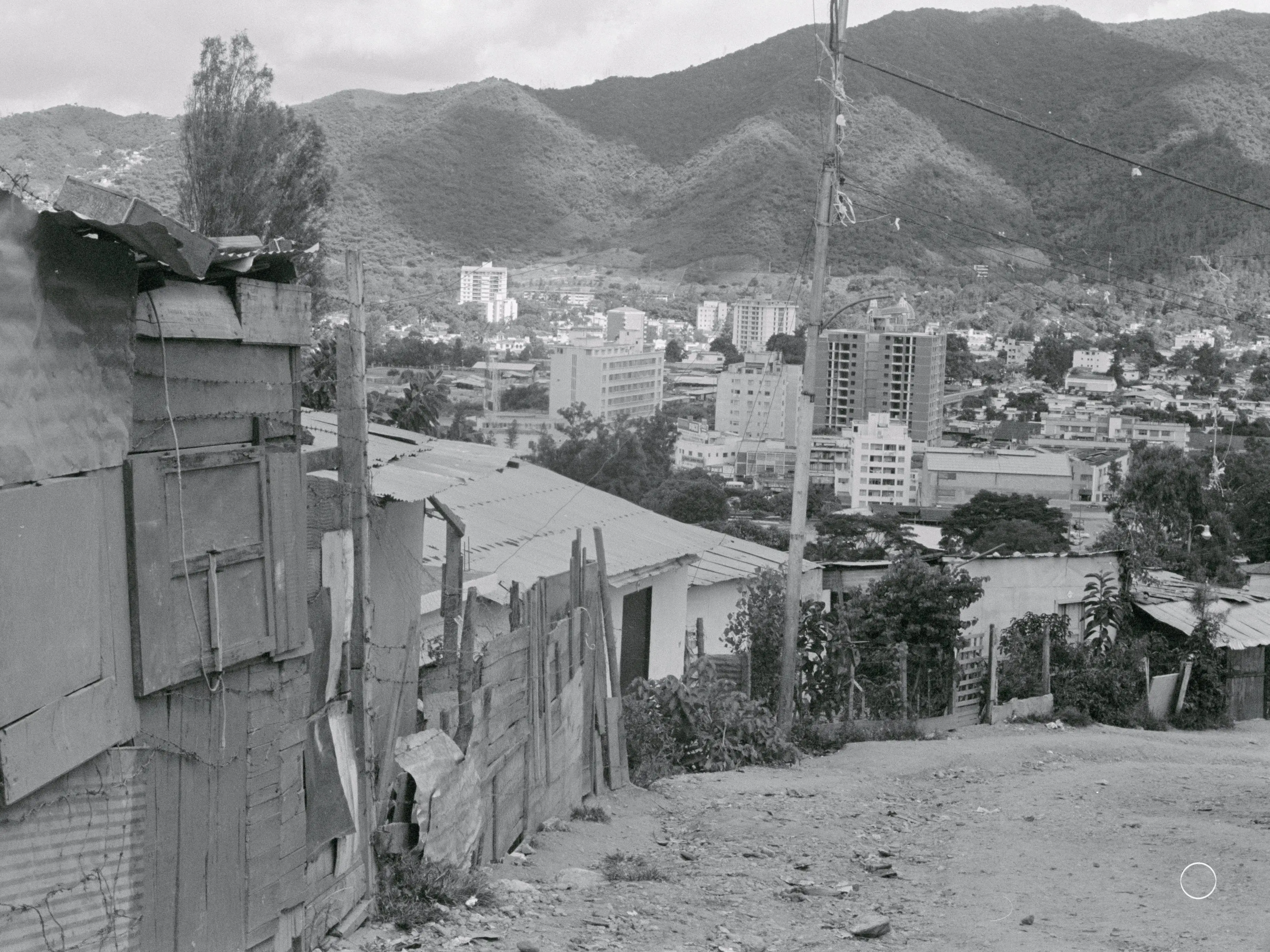Caracas: 1970. Caracas, Venezuela: One advantage of living on the hills around Caracas is the magnificent view of the city. But like many South American cities, Caracas is ringed by dismal shanty towns. Simon Bolivar, whose ashes are interred in this city of one and three quarters million, liberated the continent from the Spanish, but the shanty town dwellers are still looking for liberation from grinding poverty.