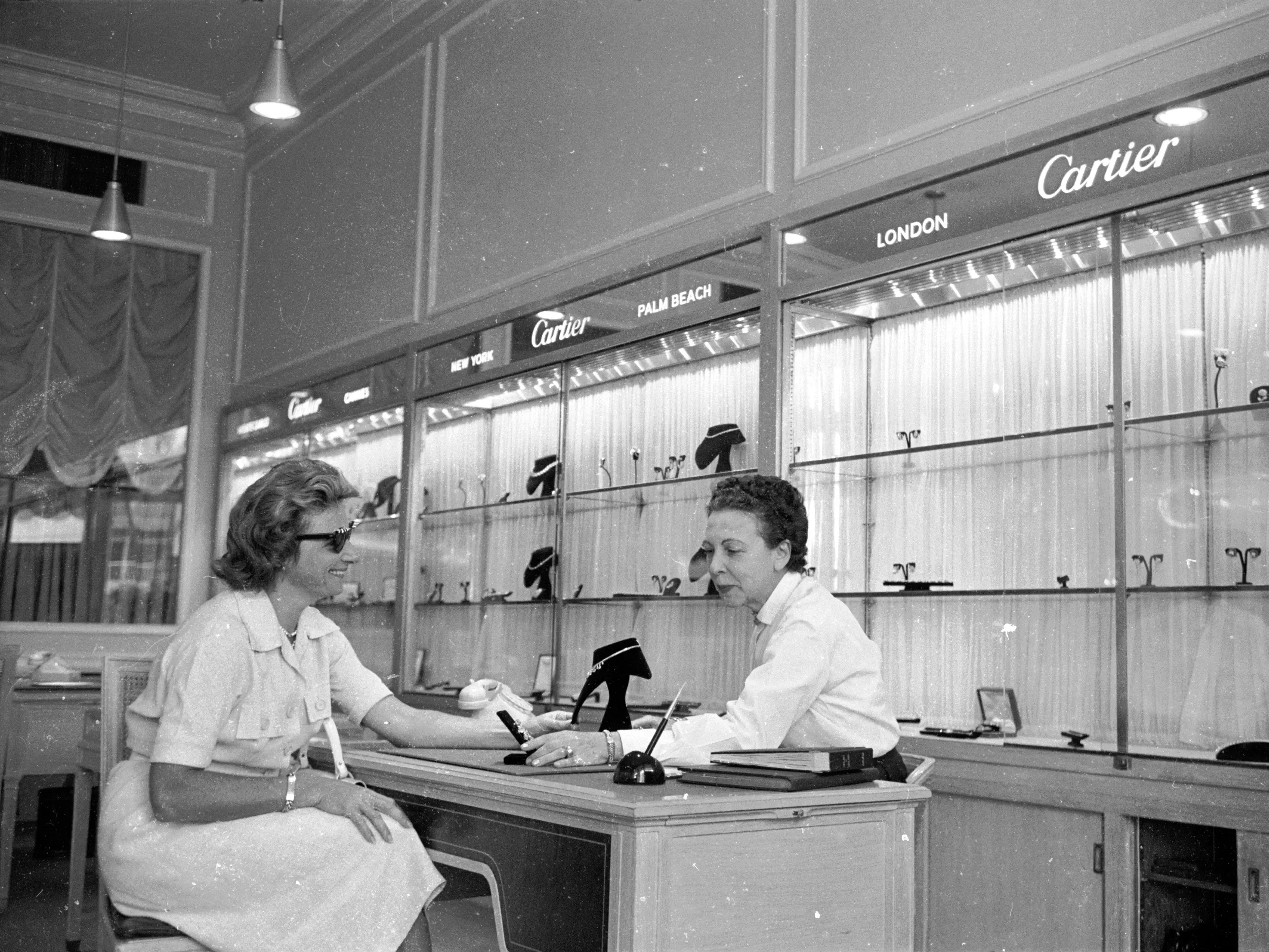 A woman consulting a jeweller in her shop in the Chacaito district of Caracas, Venezuela, circa 1955.