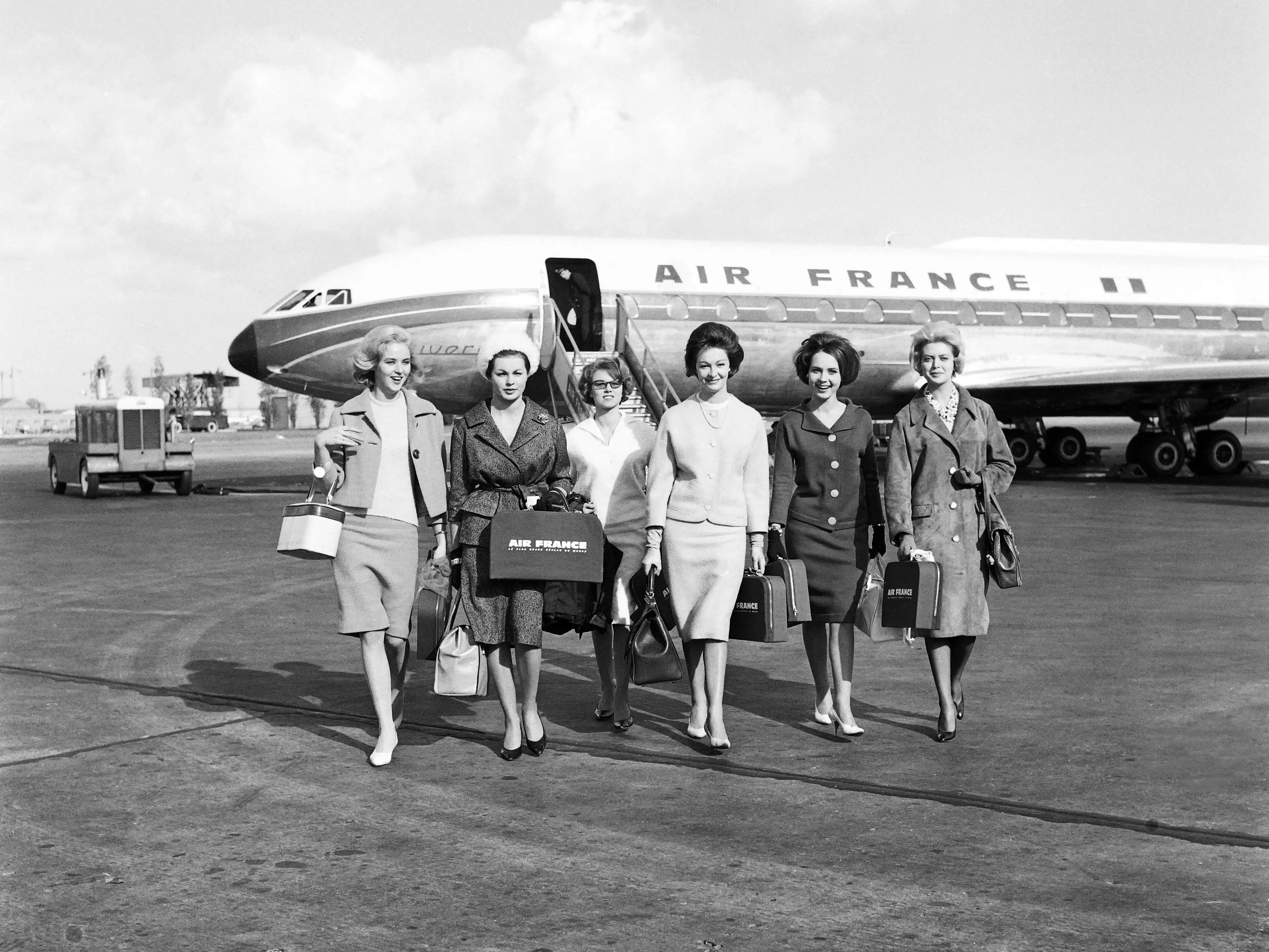 October 25, 1959 at Orly airport, near Paris, showing French fashion models going towards Caracas as French fashion ambassadors.