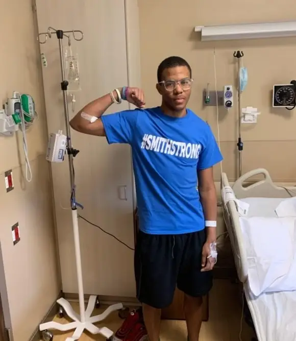 khalil with his 'smith strong' shirt on in the hospital - at a lower weight