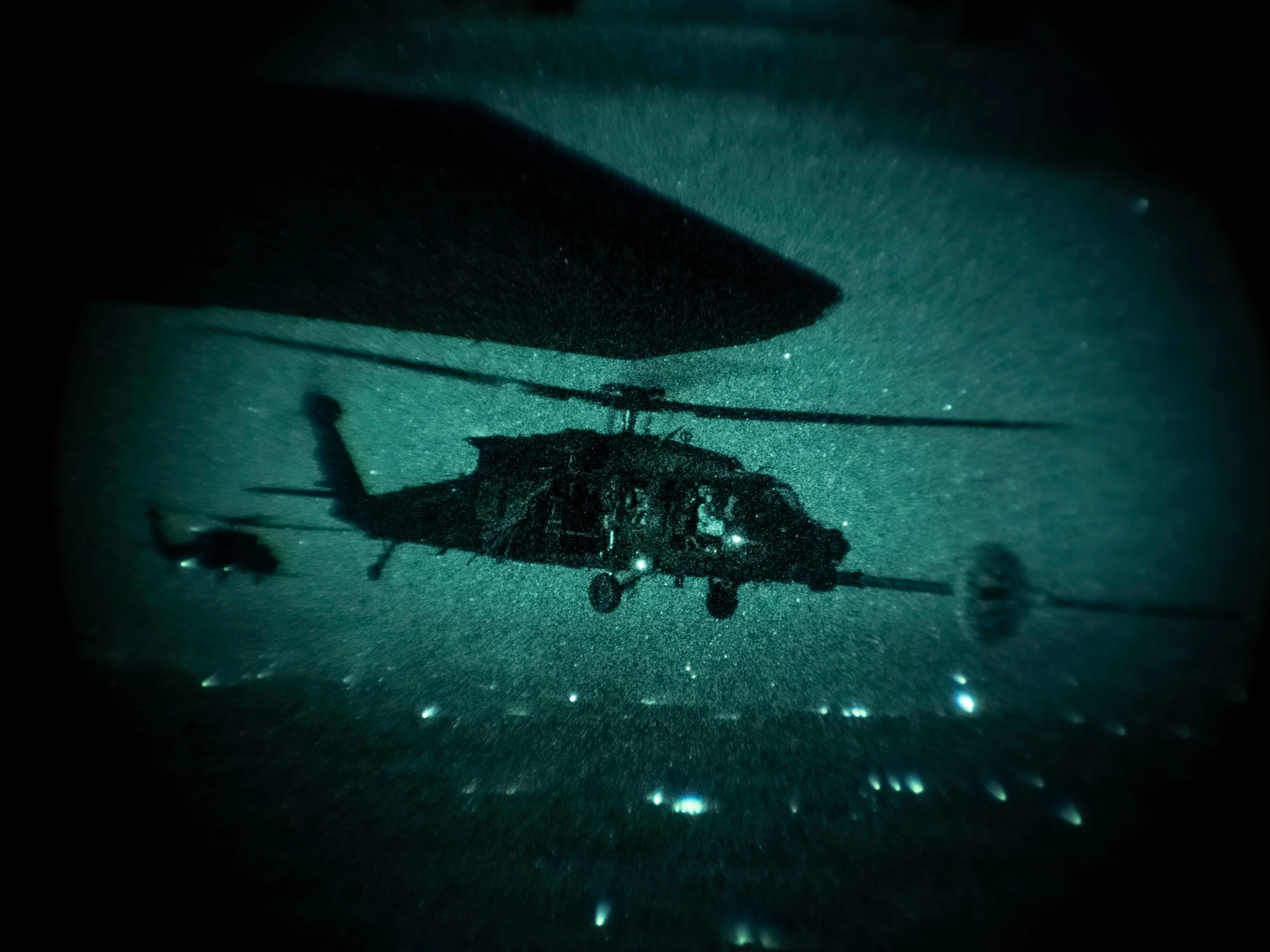 An MC-130J Commando II assigned to the 1st Special Operations Wing refuels a US Army MH-60M Black Hawk assigned to the 160th Special Operations Aviation Regiment (Airborne) during a helicopter air-to-air refueling exercise near Hurlburt Field, Florida, Nov. 20, 2025.