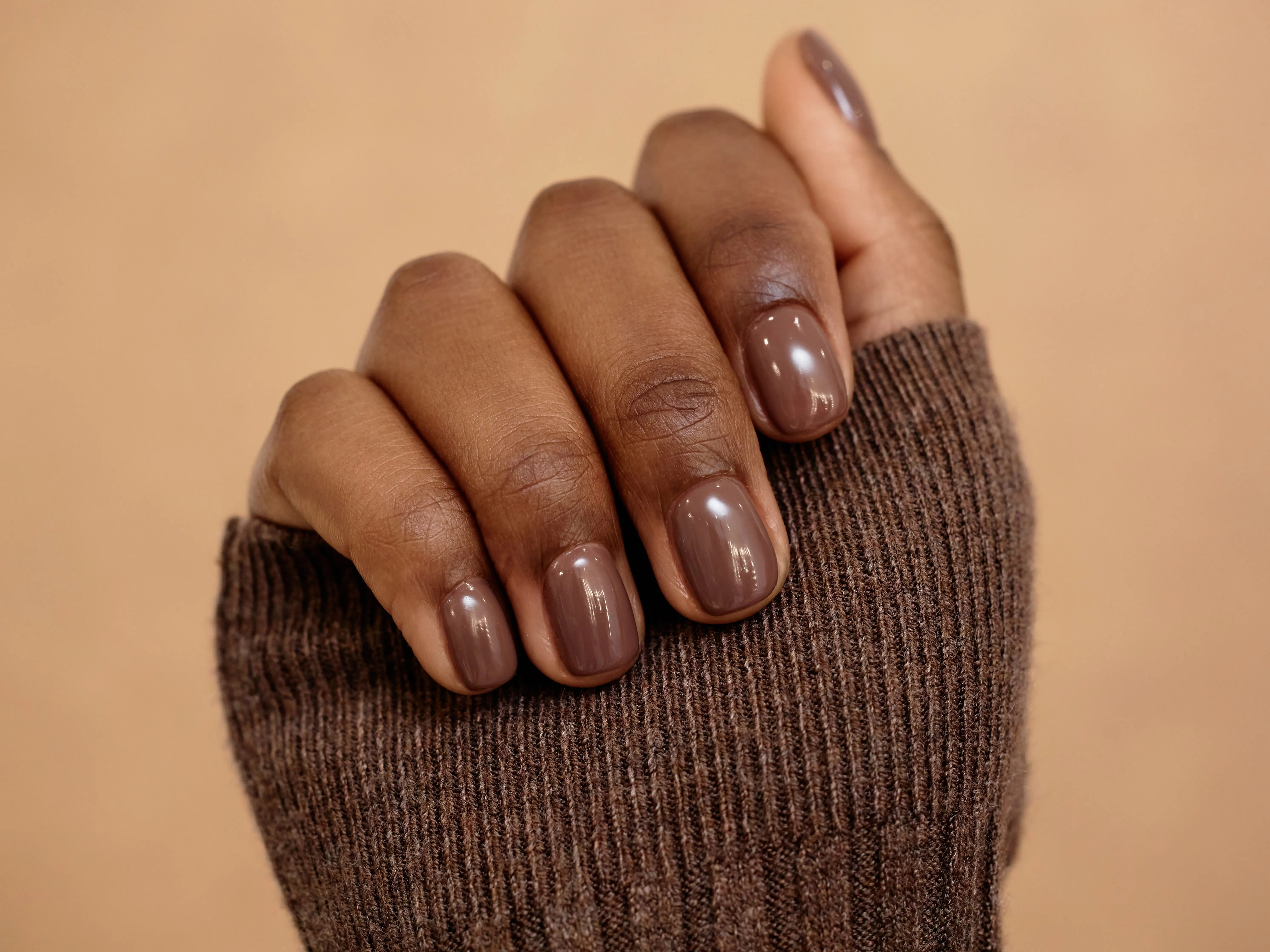 A rich-brown manicure.