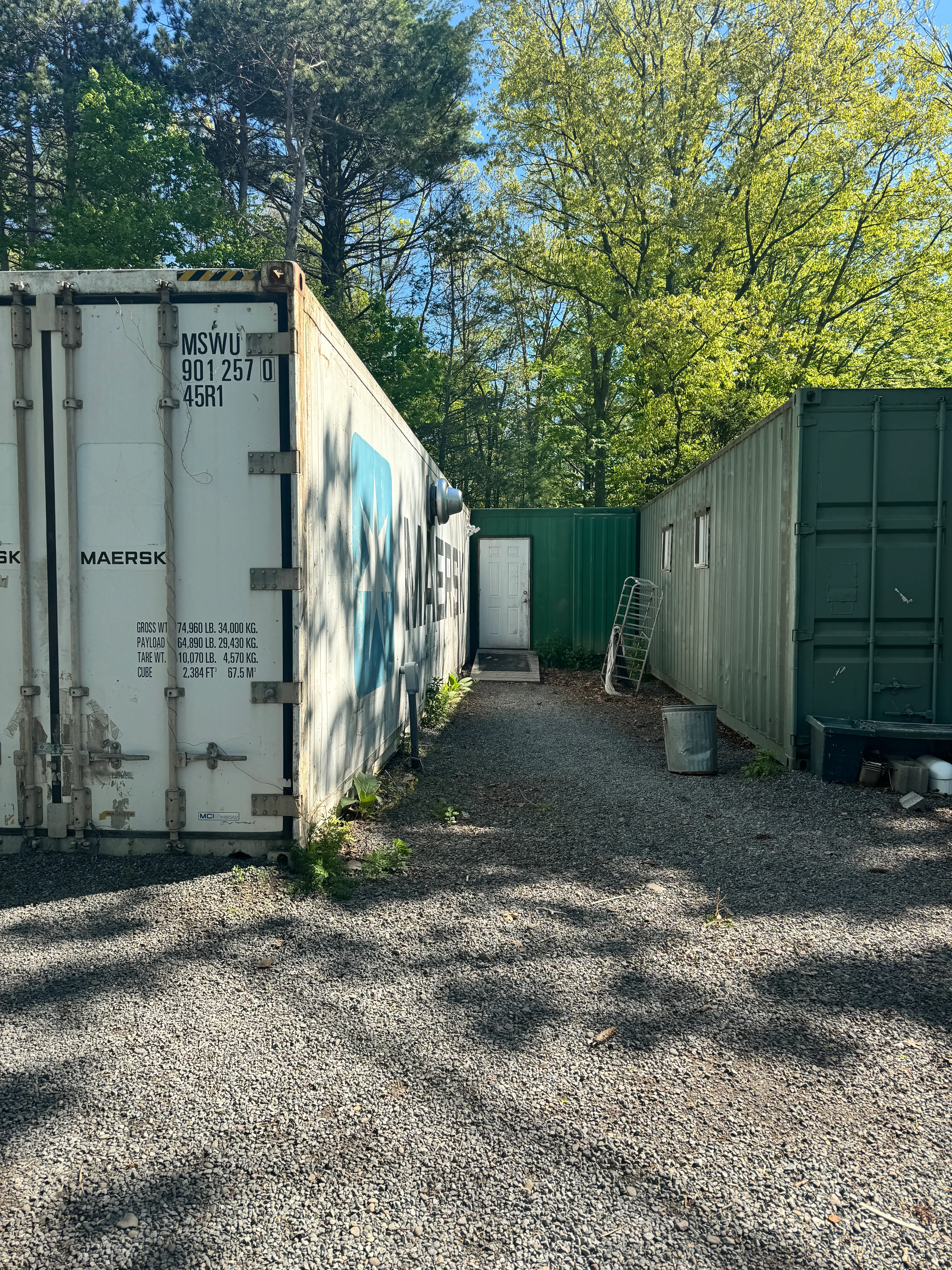 Three conjoined shipping containers.