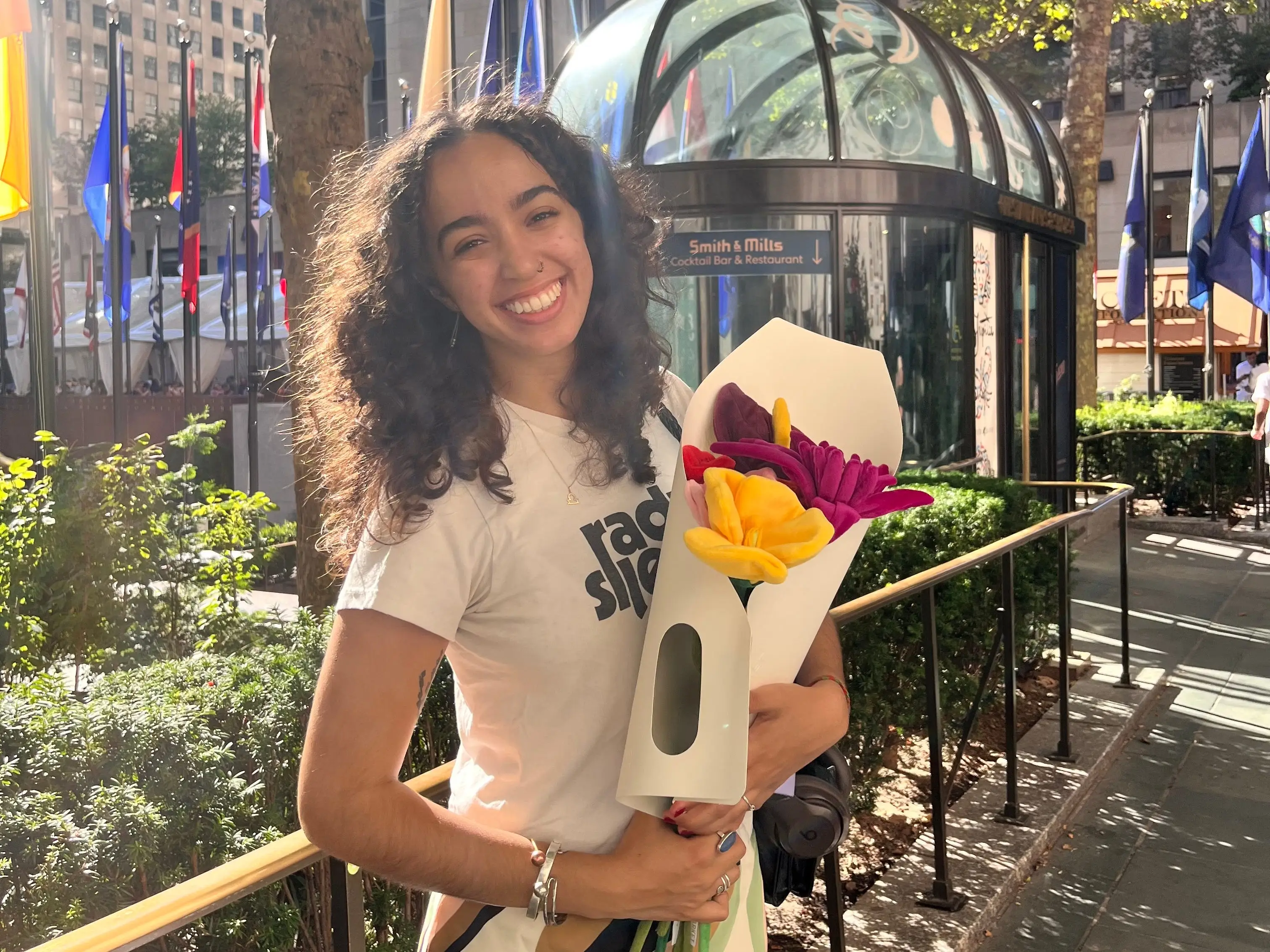 The author holding a bouquet in New York City.