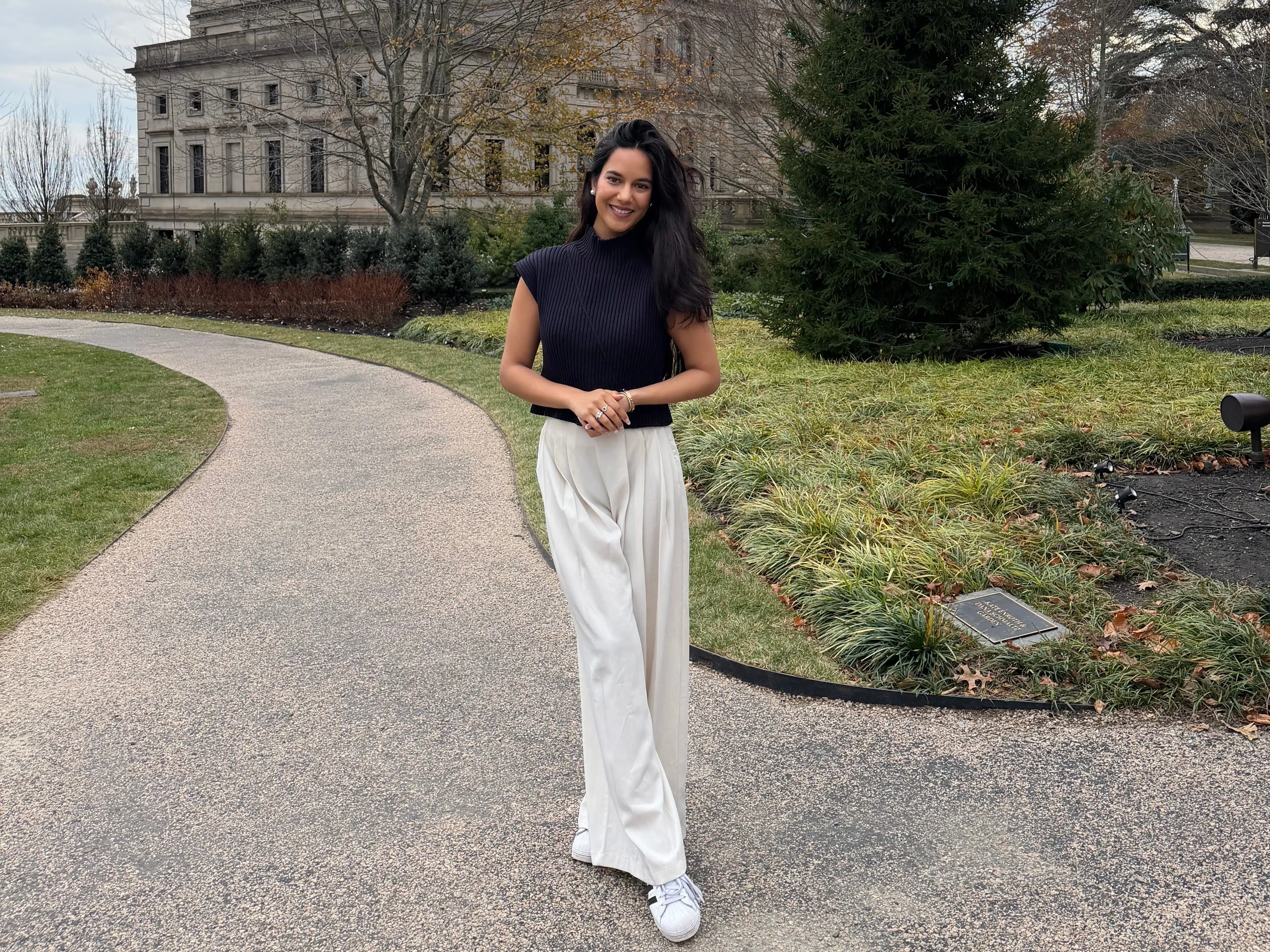 Maitri Mangal standing in front of building
