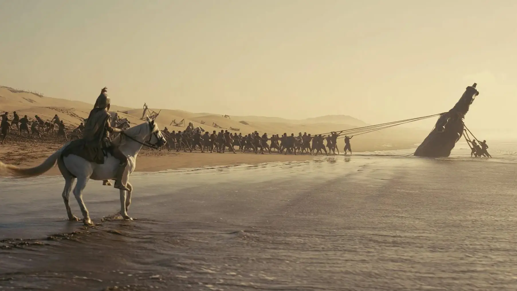 Soldier on horse looking at men lift structure in the odyssey