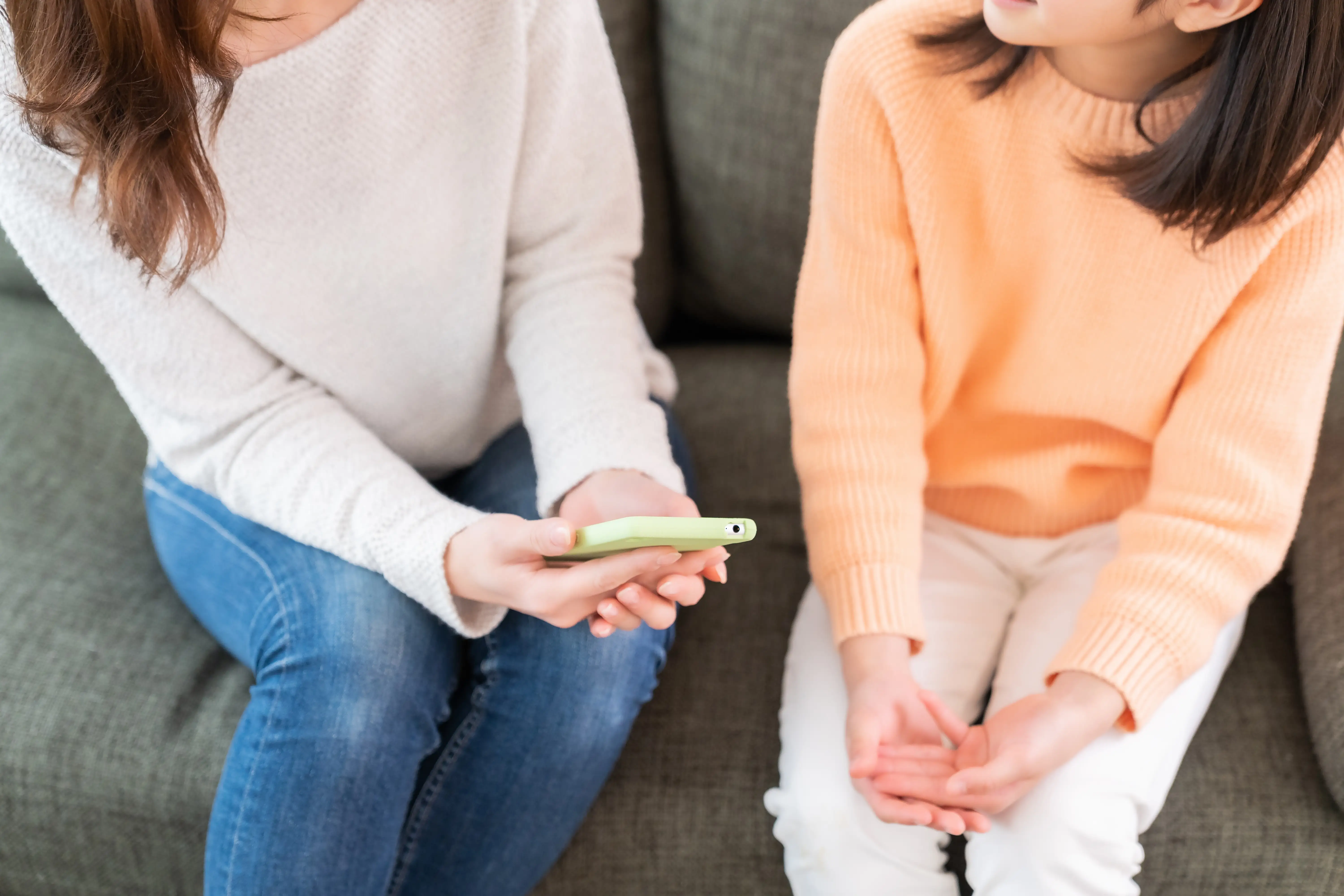 Asian mother and daughter,smart phone, hands