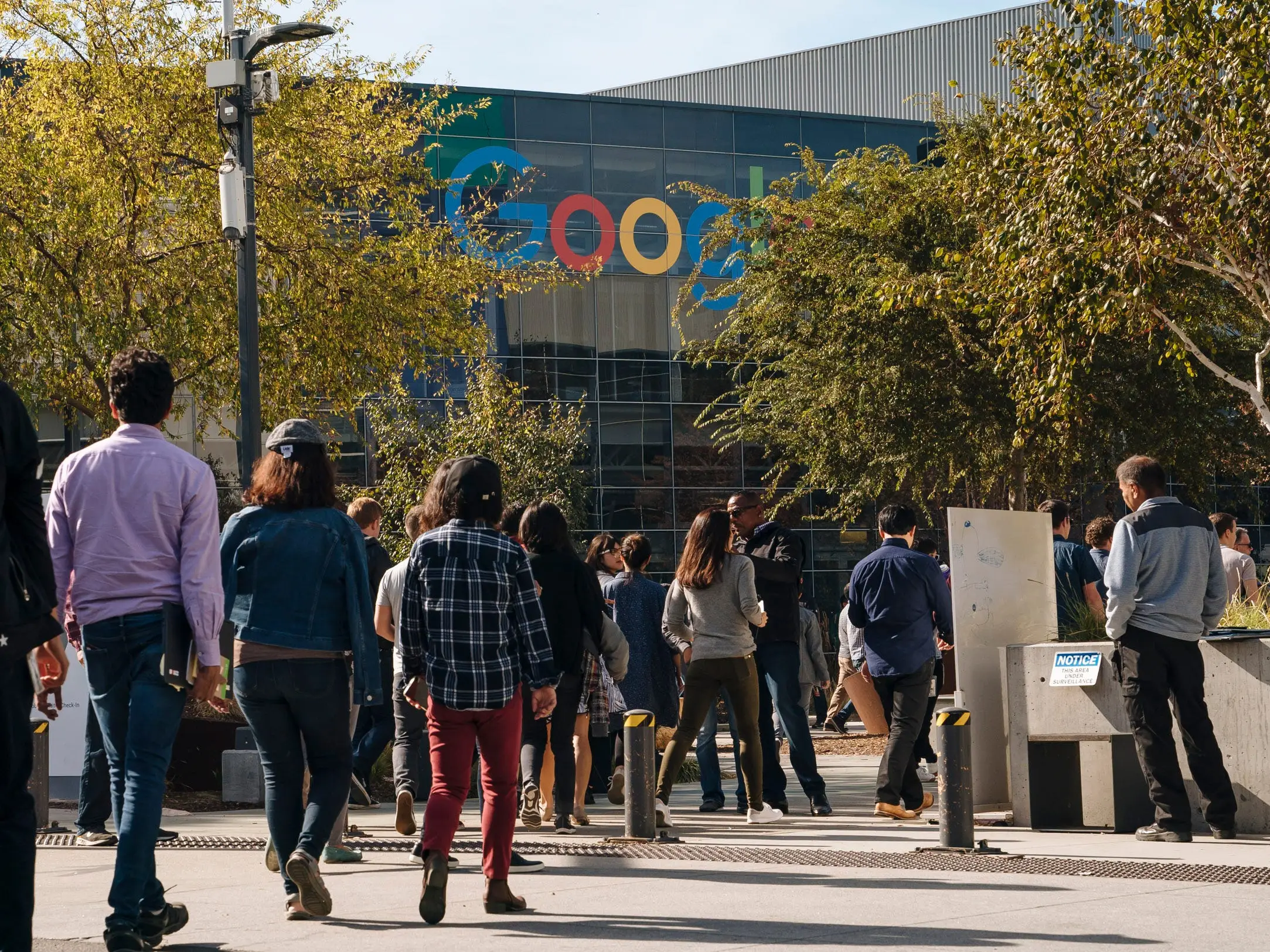 People walking into Google office.