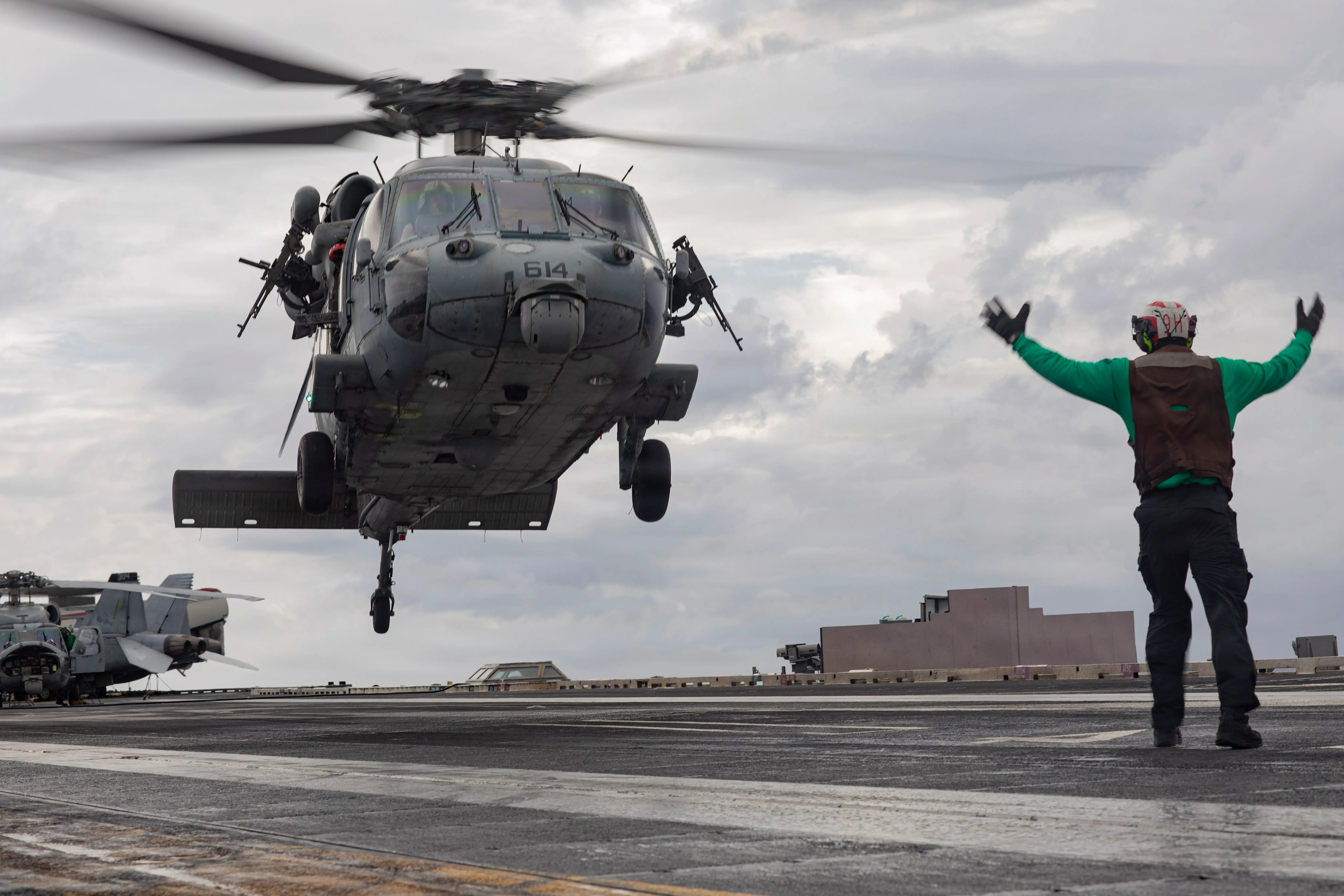 An MH-60S Sea Hawk helicopter, attached to Helicopter Sea Combat Squadron 9, lands on the flight deck of the world's largest aircraft carrier, Ford-class aircraft carrier USS Gerald R. Ford (CVN 78), after a right of visit boarding operation while underway in the Atlantic Ocean, Jan. 7, 2026.