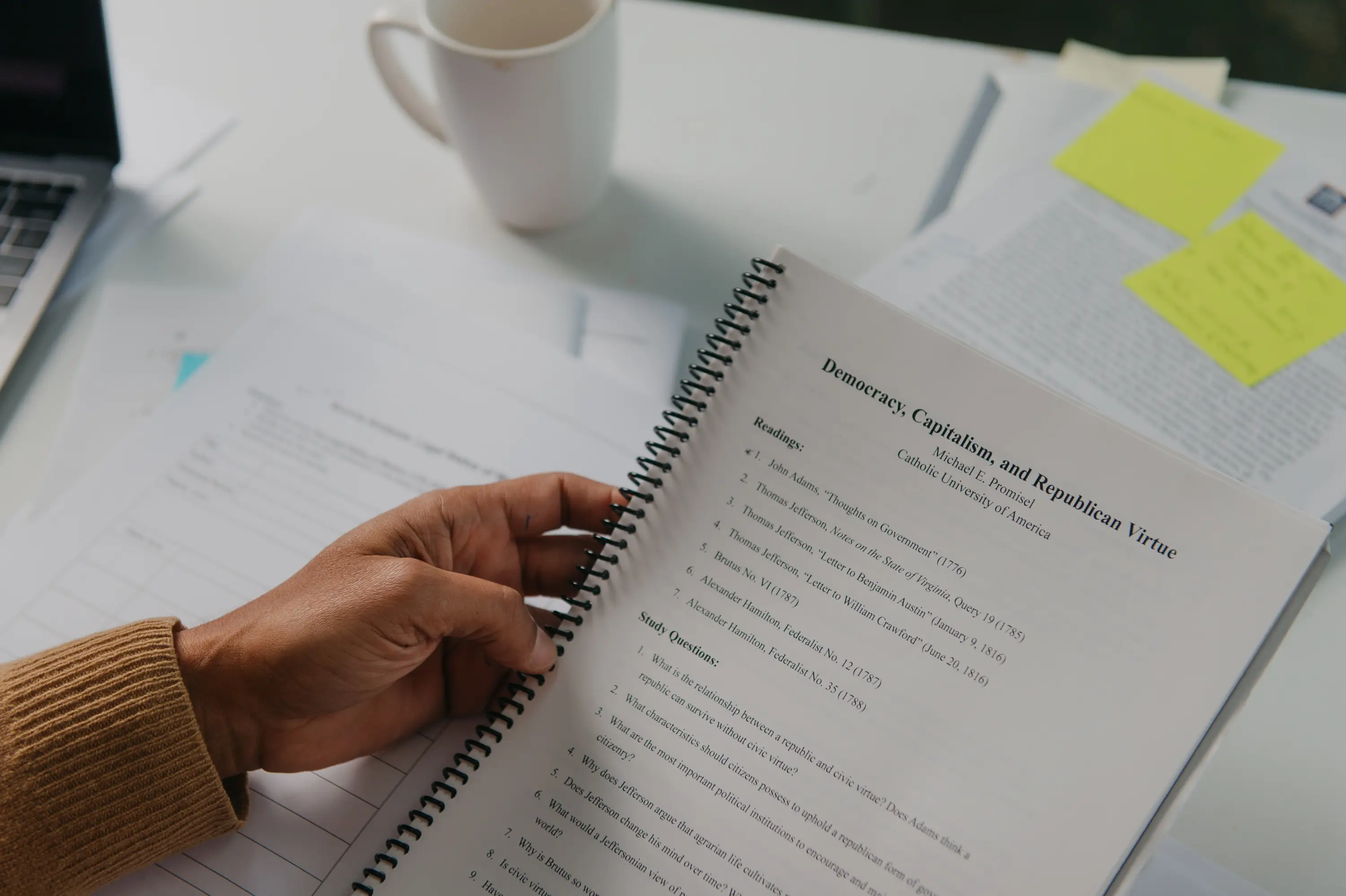 A teacher holding a lesson plan