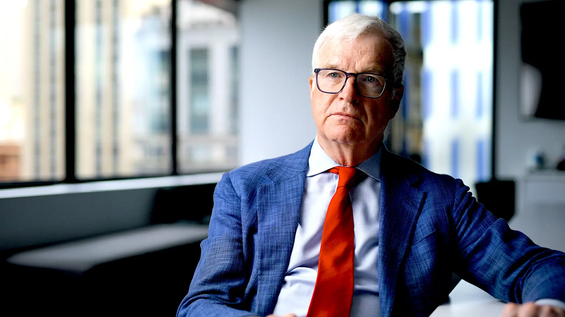 James Kiernan in a blue blazer and red tie.