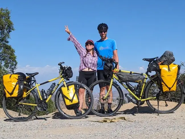 Zoe Ashbridge and her husband with their bikes