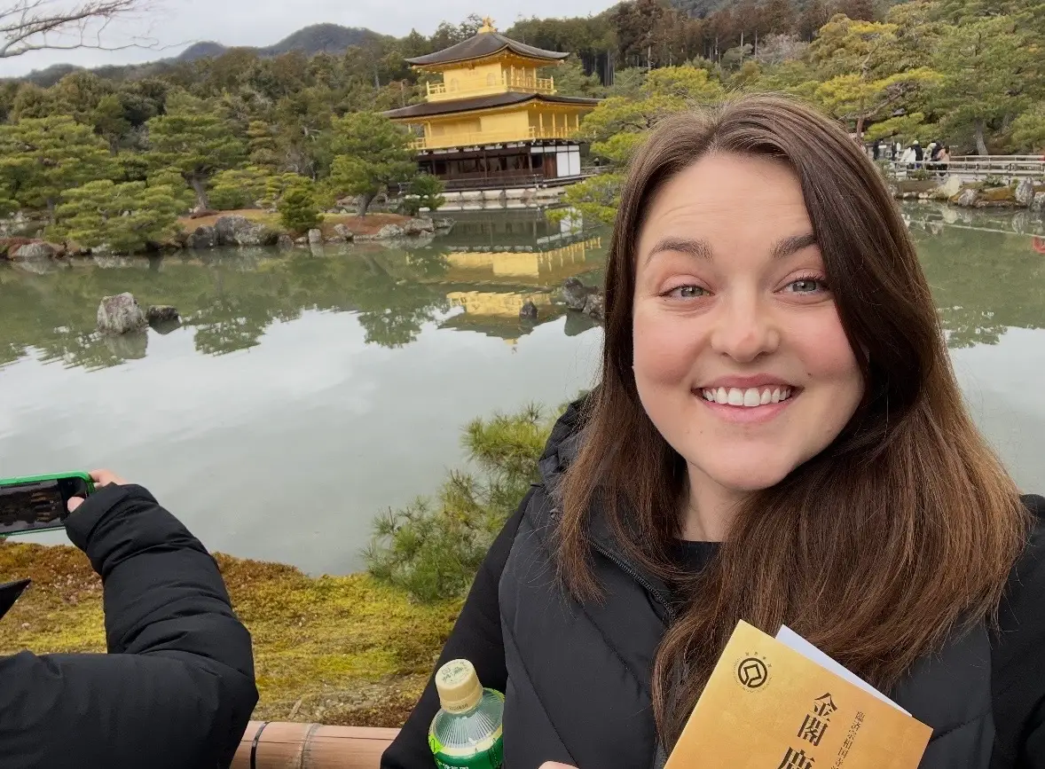 Private flight attendant Kelley Lokensgard at the golden temple in Kyoto.
