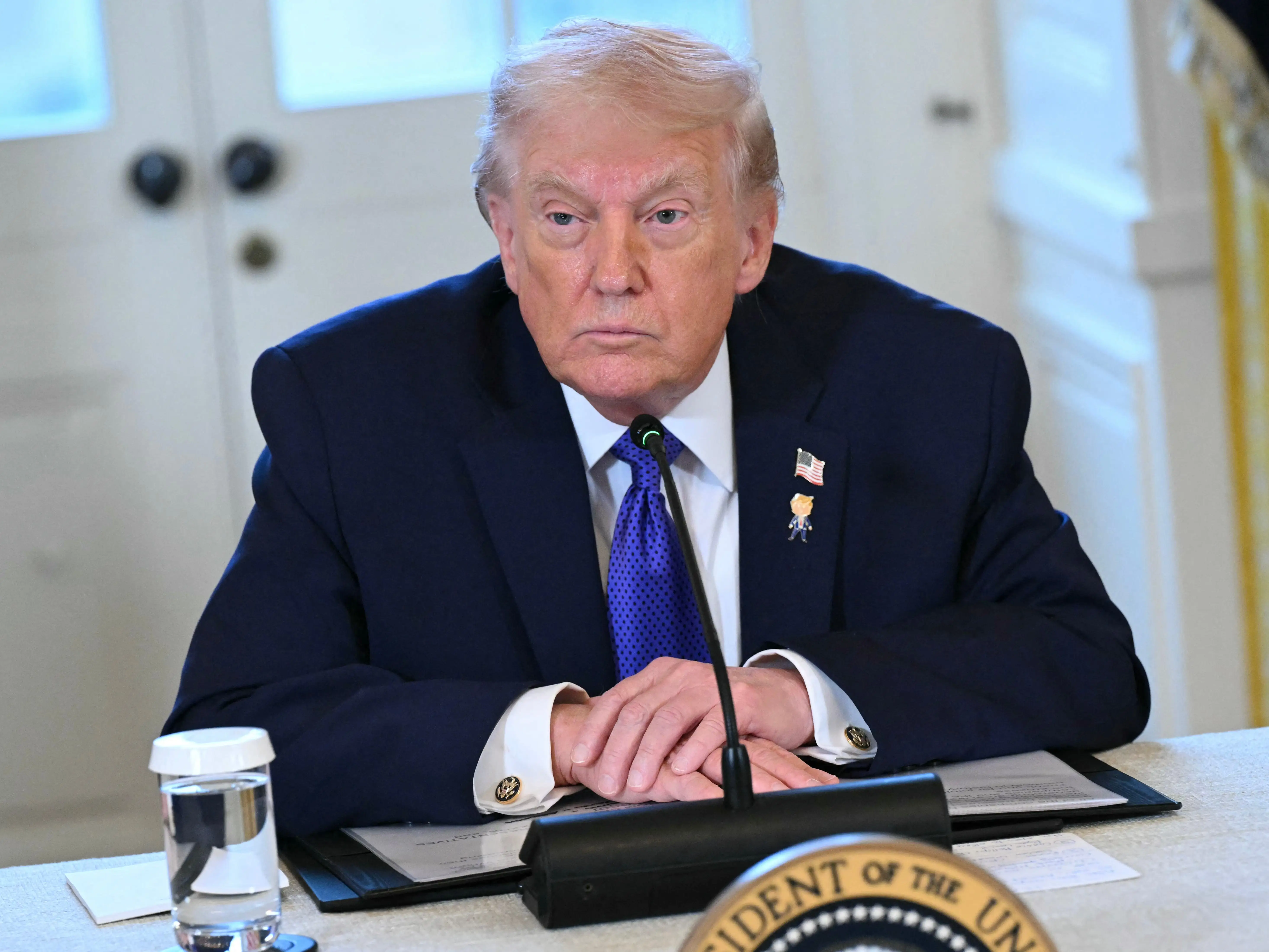 President Donald Trump looks on during a meeting with US oil companies executives in the East Room of the White House in Washington, DC on January 9, 2026.