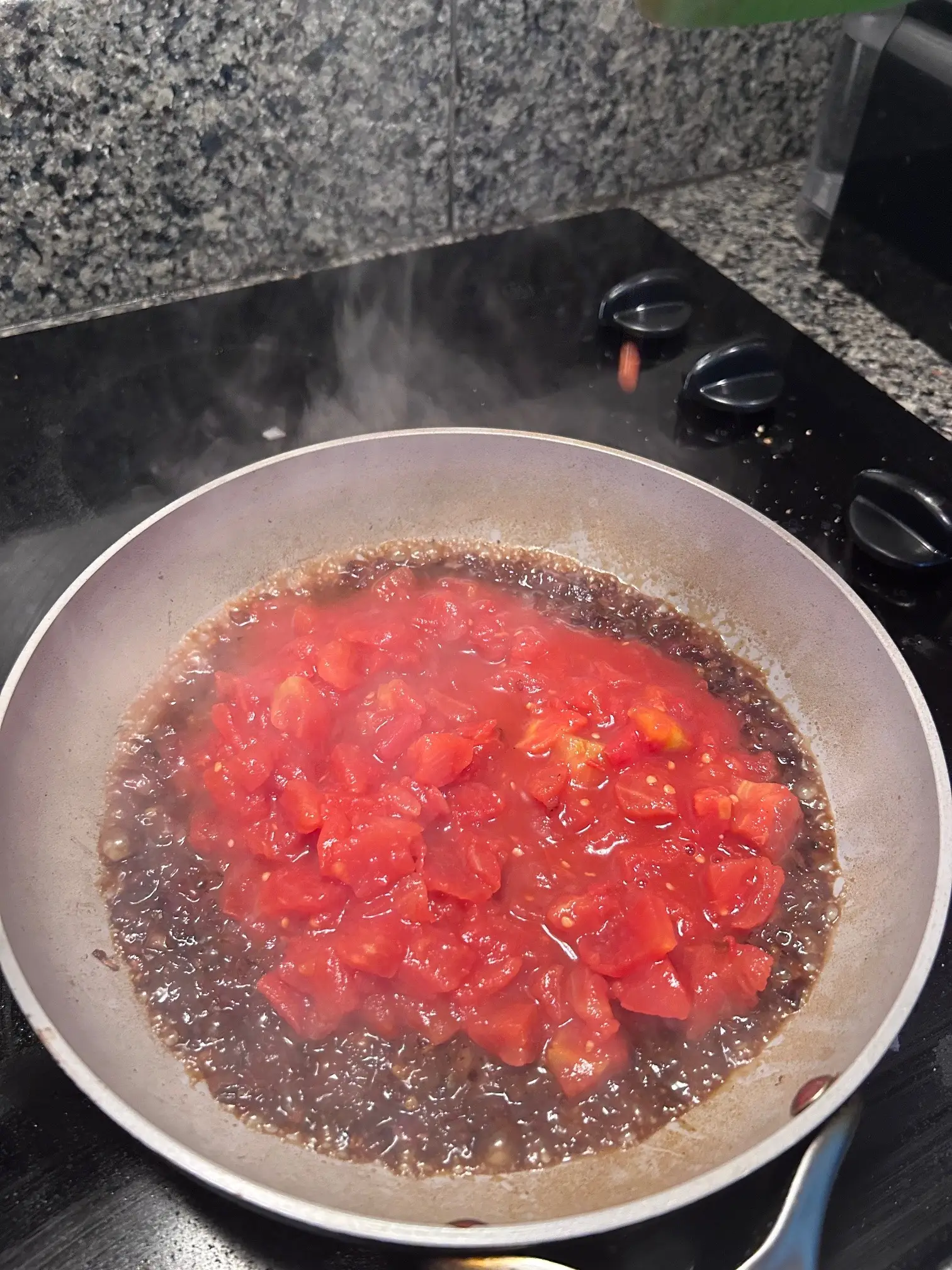 Adding tomatoes to onions for Gordon Ramsay's Bloody Mary Pasta