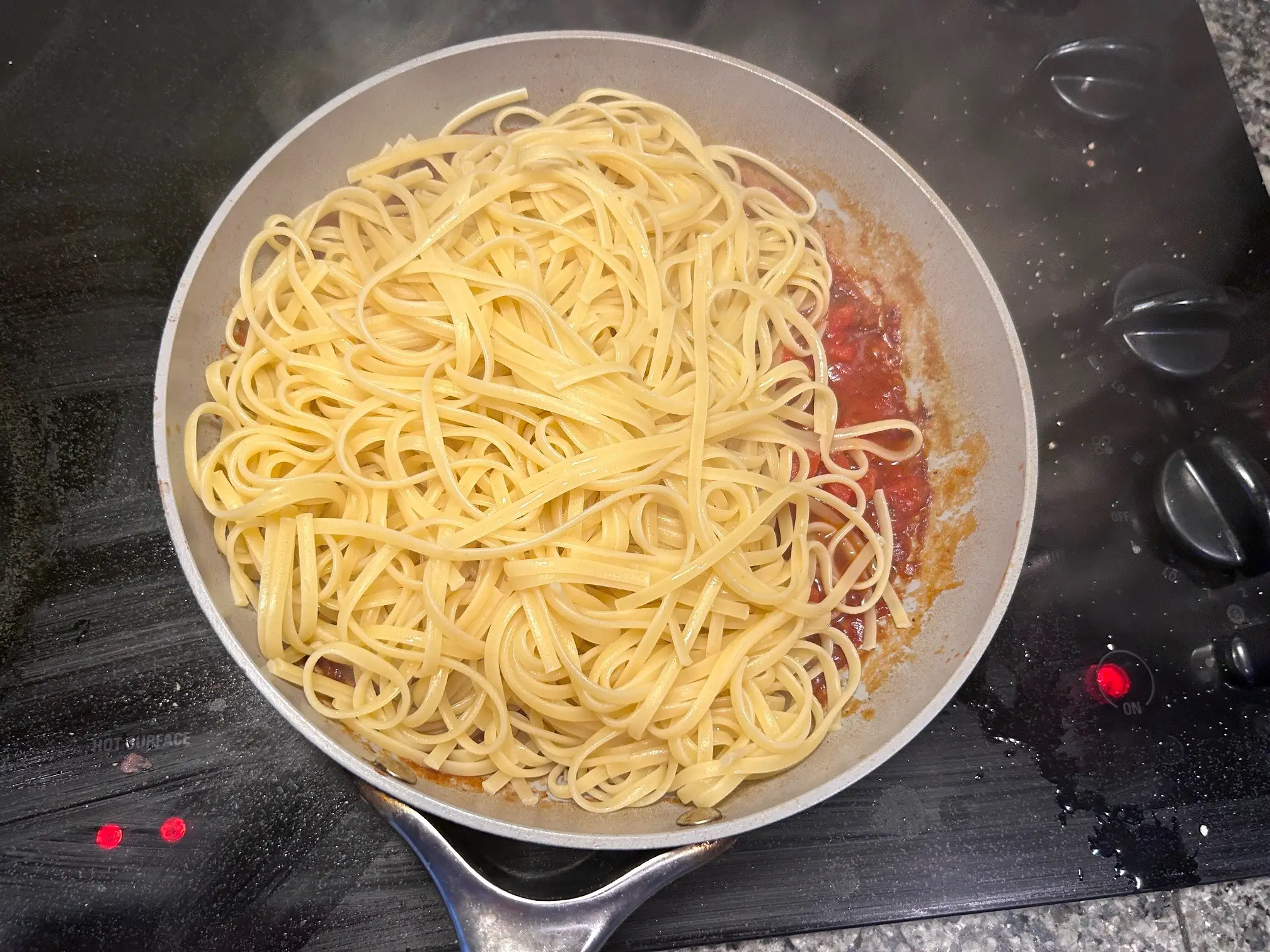 Adding pasta to sauce for Gordon Ramsay's Bloody Mary Pasta