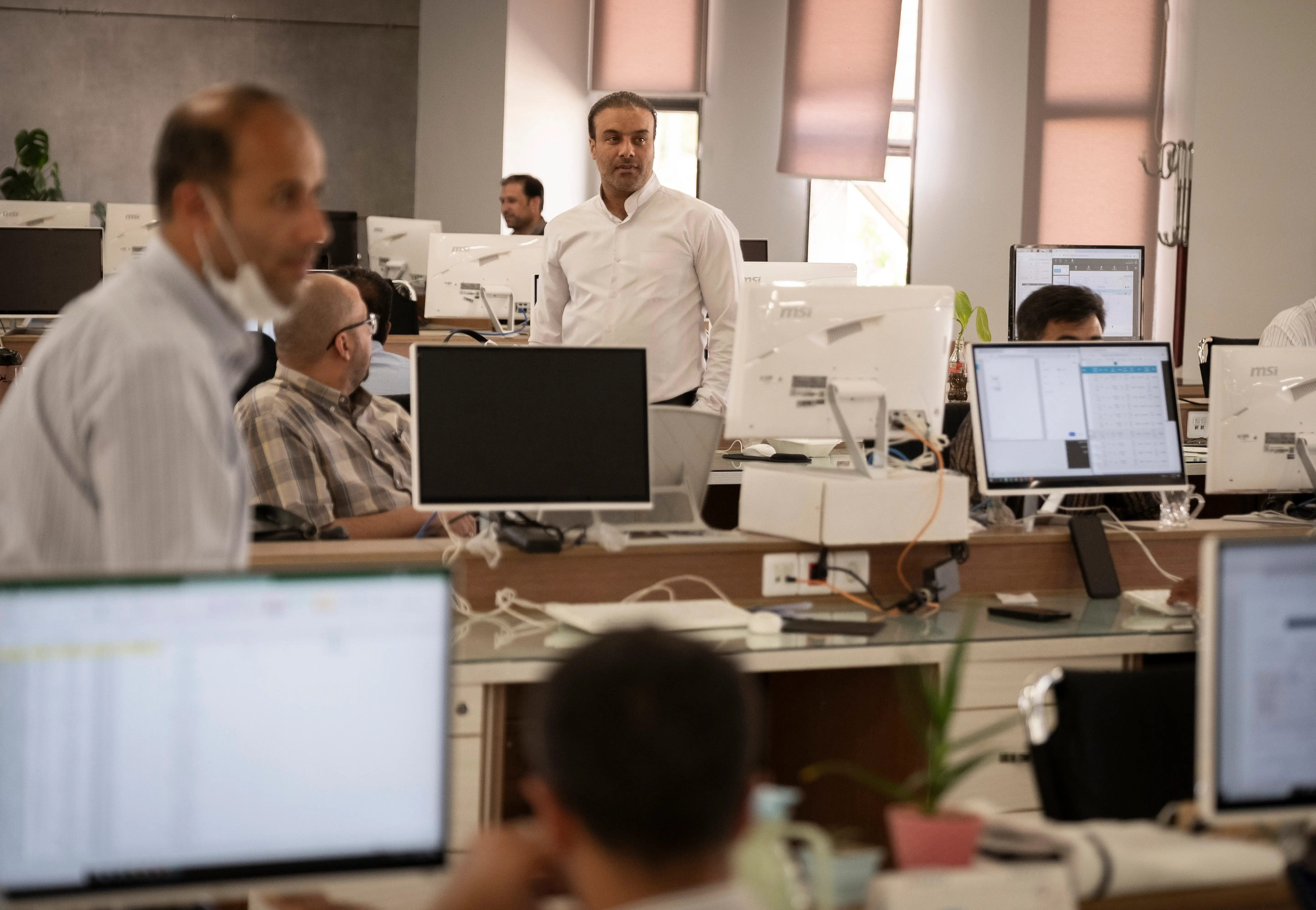 Iranian employees at the AI headquarters of the Resalat Qarz Al-Hasanah bank in Kerman, Iran, on May 4, 2025.