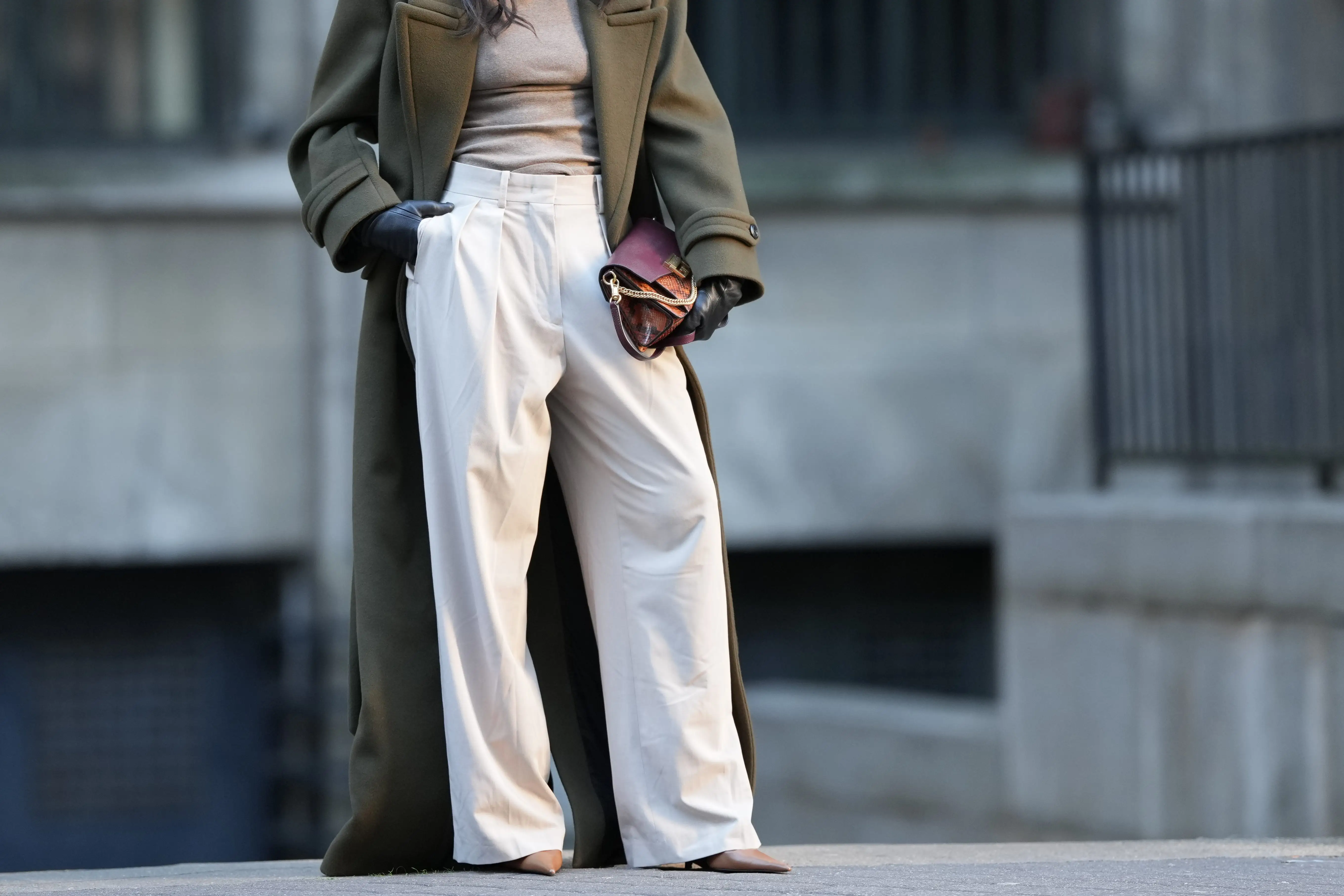 Wide-leg white trousers with long olive coat
