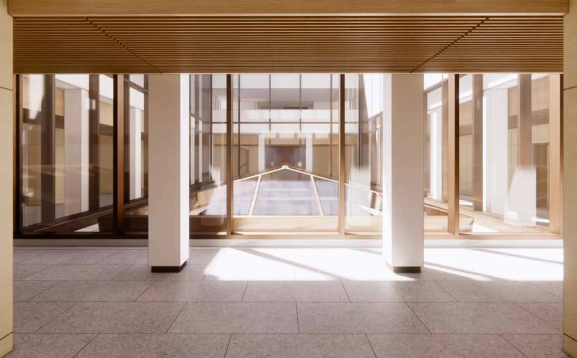 A peaked natural light shaft with bronze beams lets light strem into the fourth floor.
