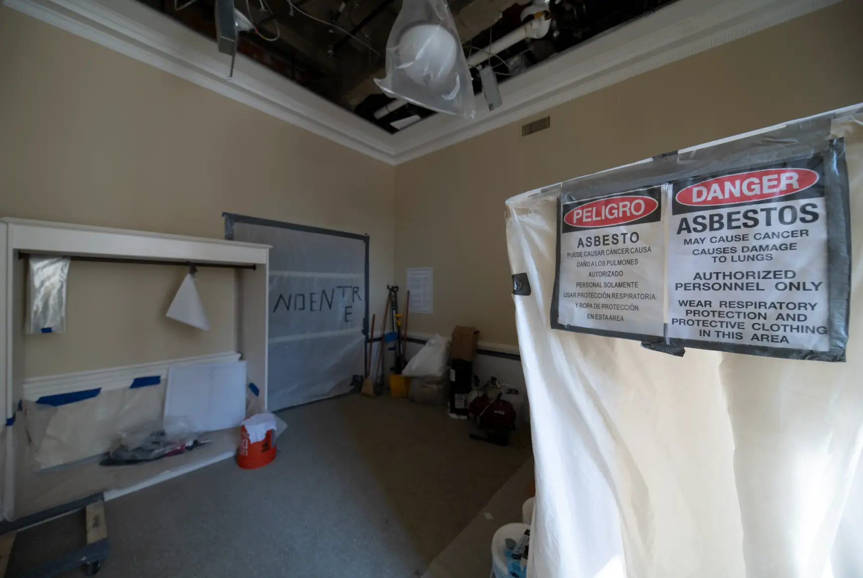 Tarp is wrapped over sections of the Fed building where asbestos was found