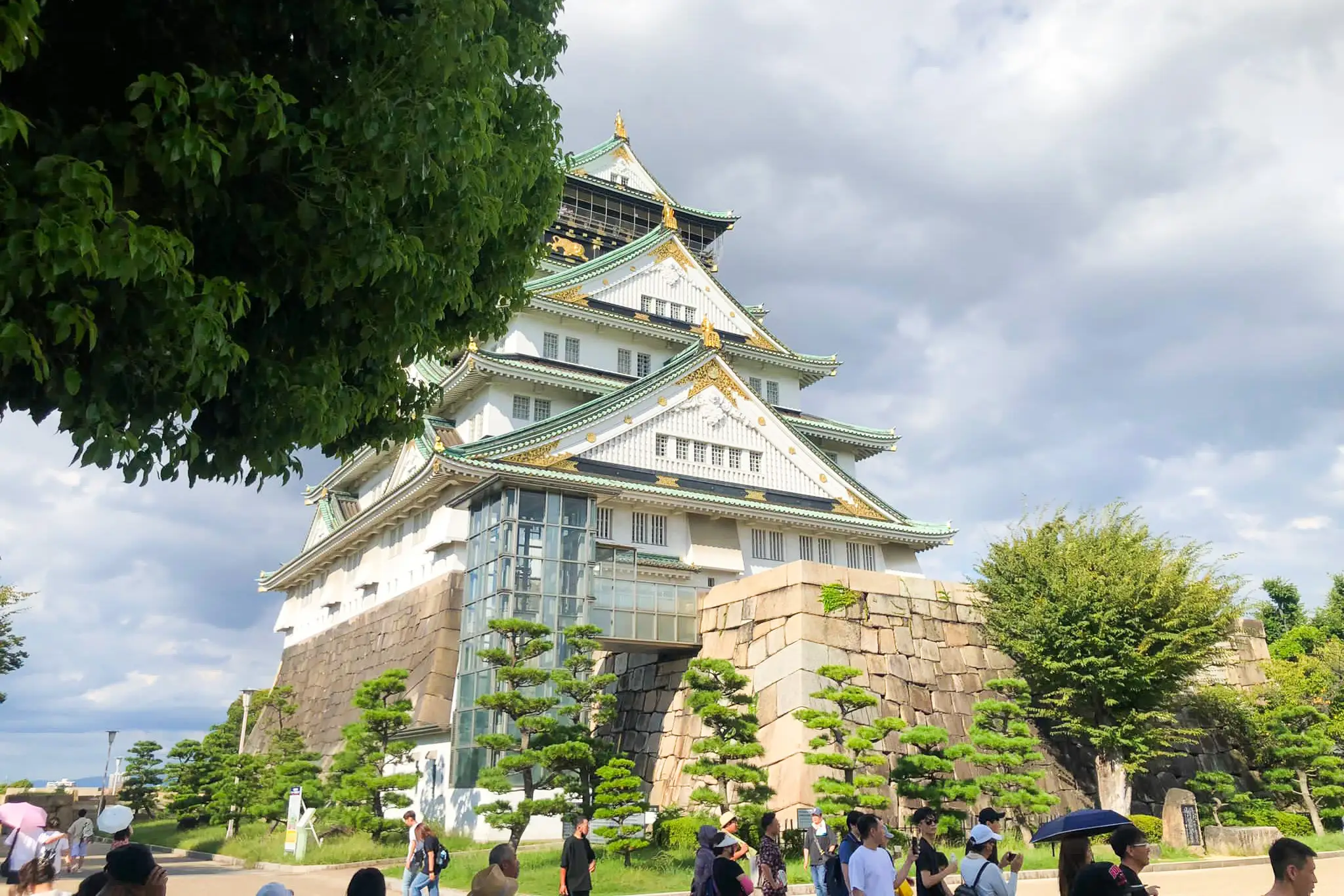 Osaka Castle partially blocked by trees