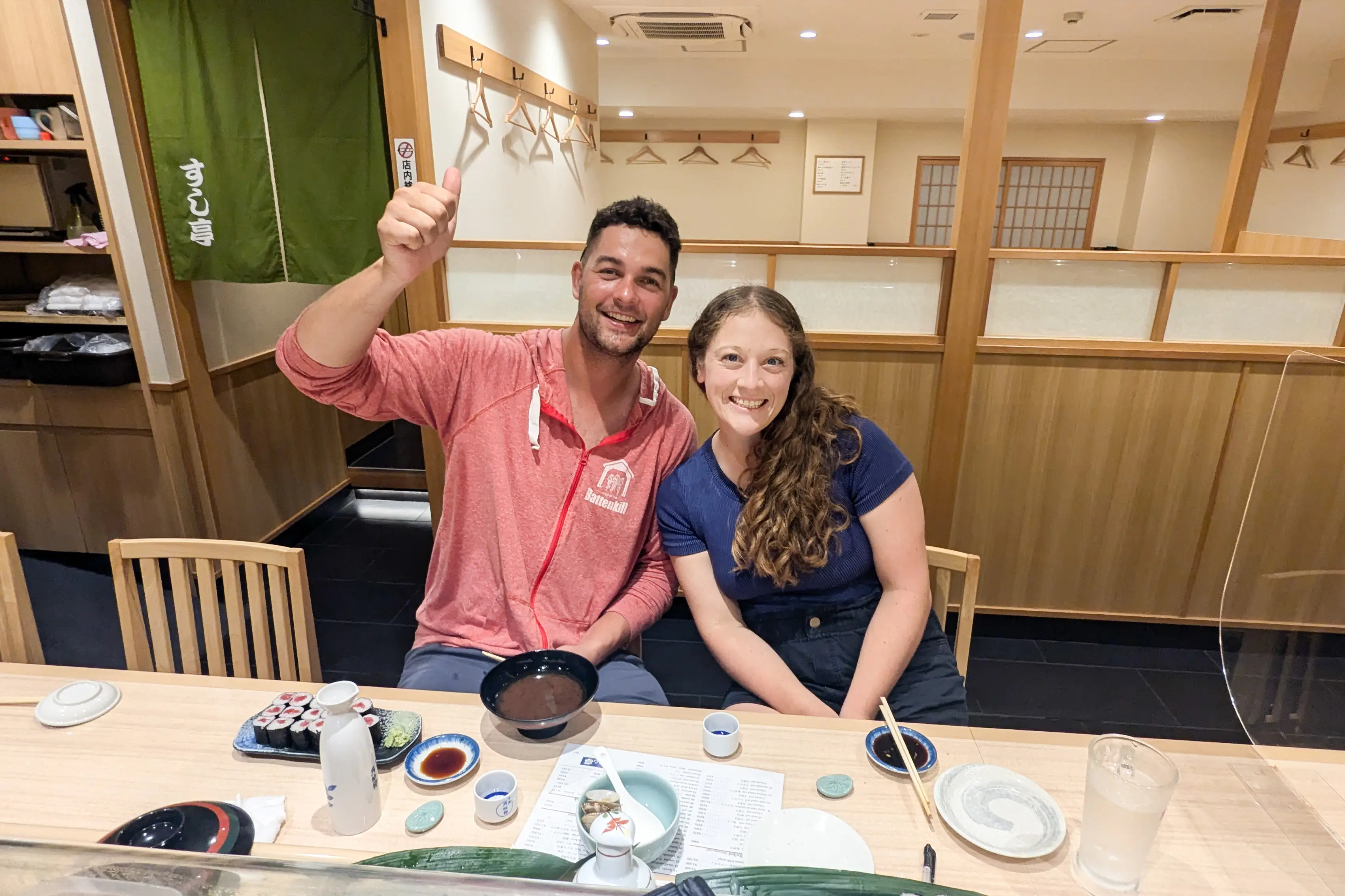 Woman smiling with man in restaurant in Japan
