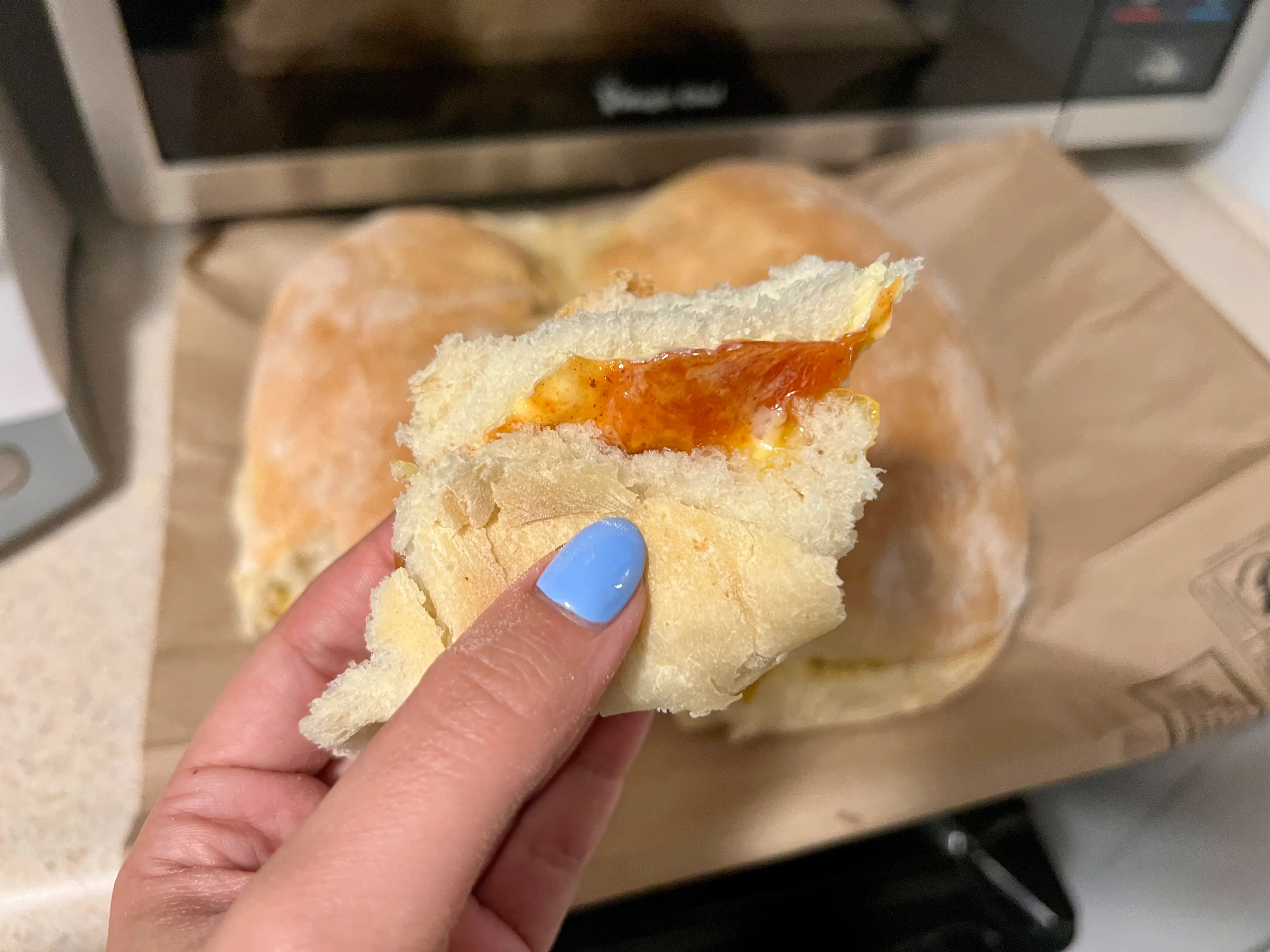 Piece of bread with guava jam on it