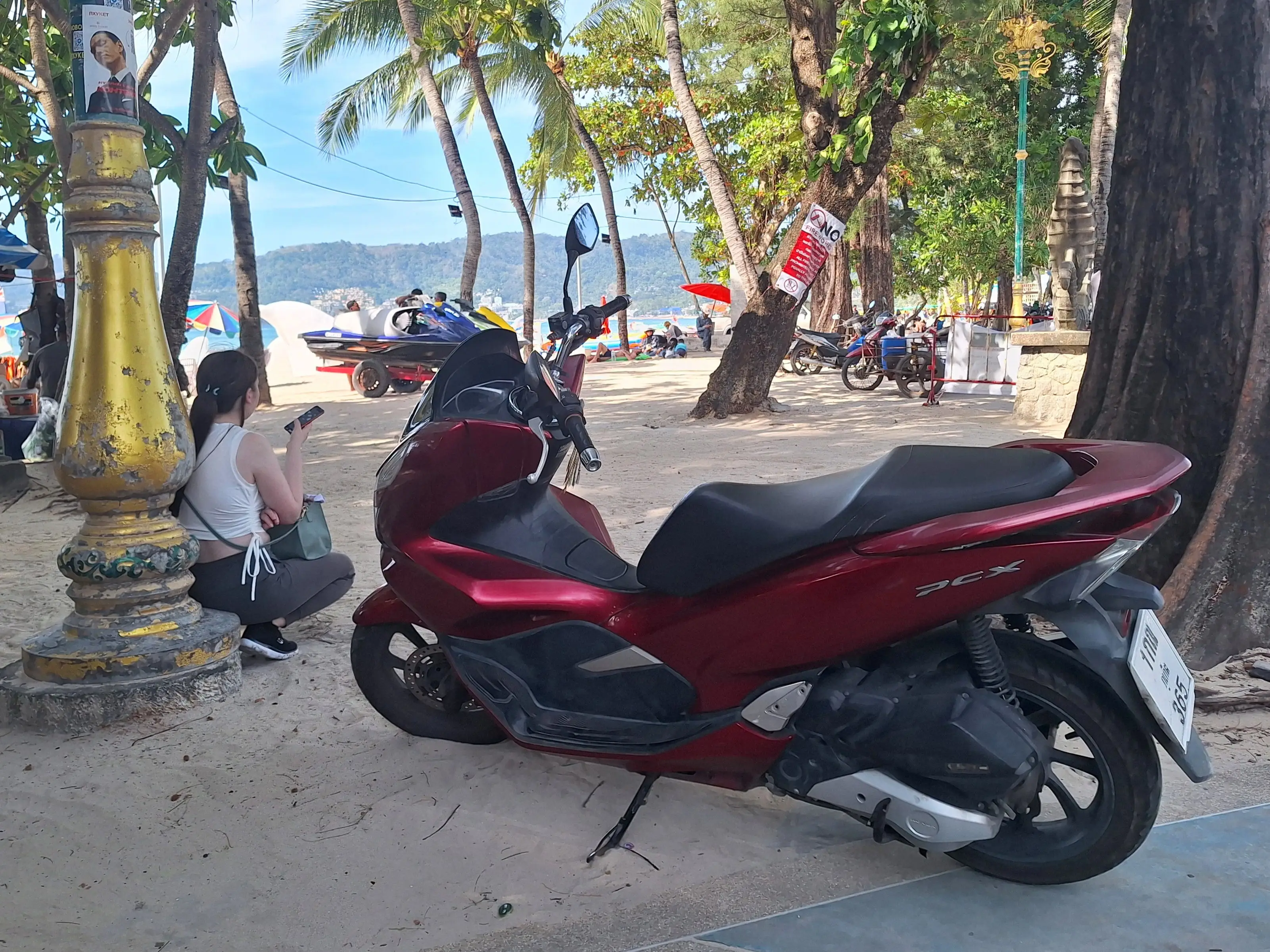 A motorbike on a beach in Thailand.