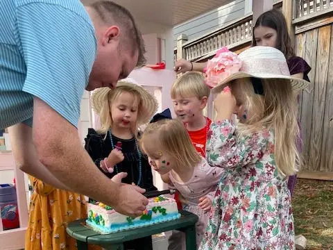 Toddler blowing birthday candles