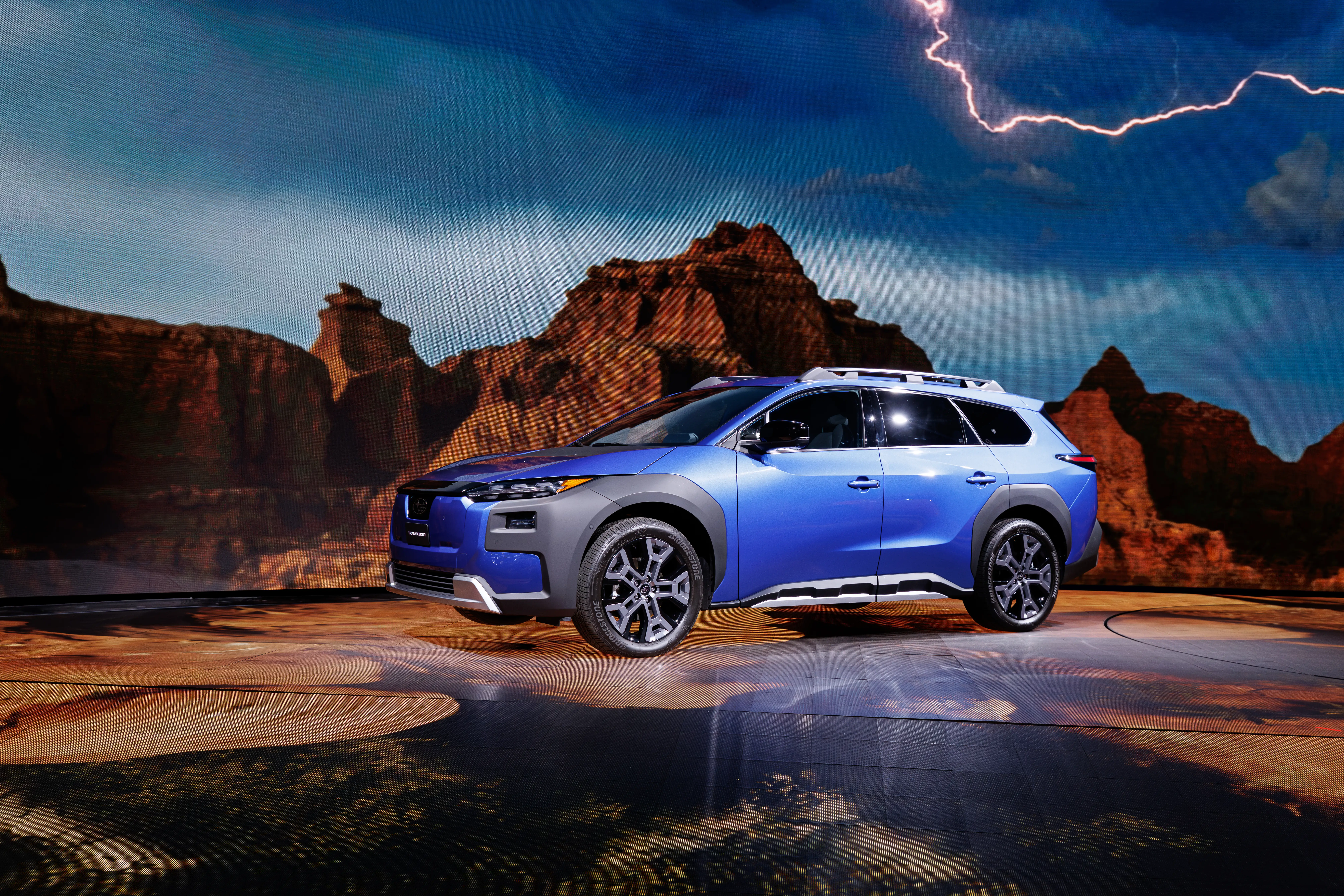 A blue Subaru Trailseeker on stage at the LA Auto Show.