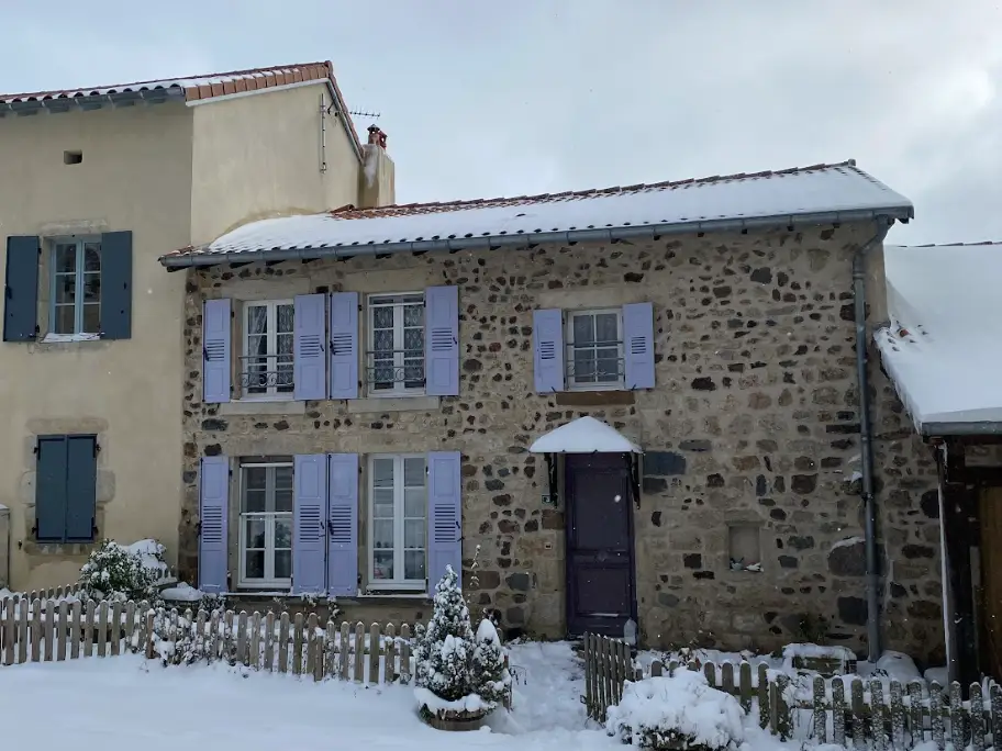 A snow-covered house in a French village.