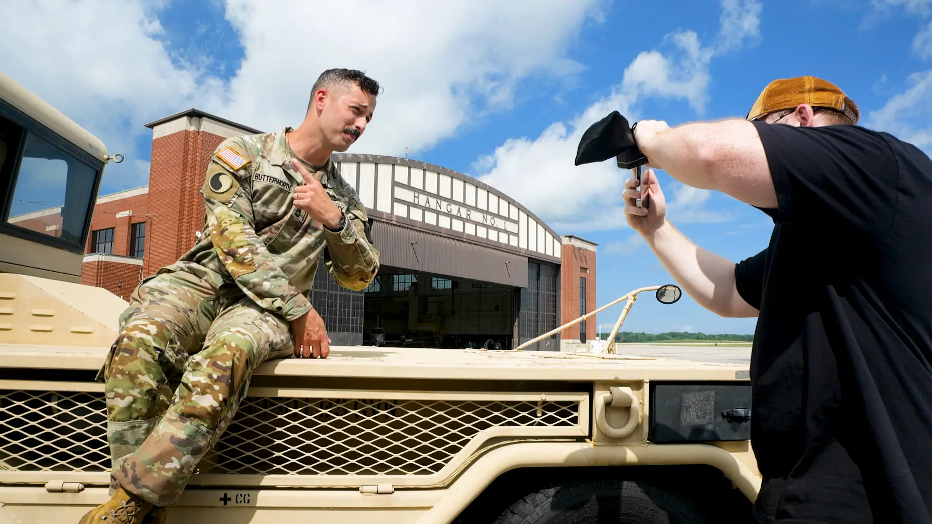 Tyler Butterworth in uniform recording content for his social media while at Fort Knox.