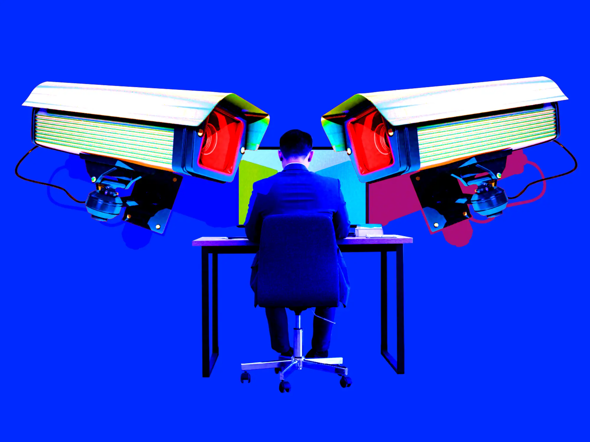 Surveillance cameras focused on an employee at their desk.