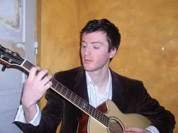 A man playing a guitar