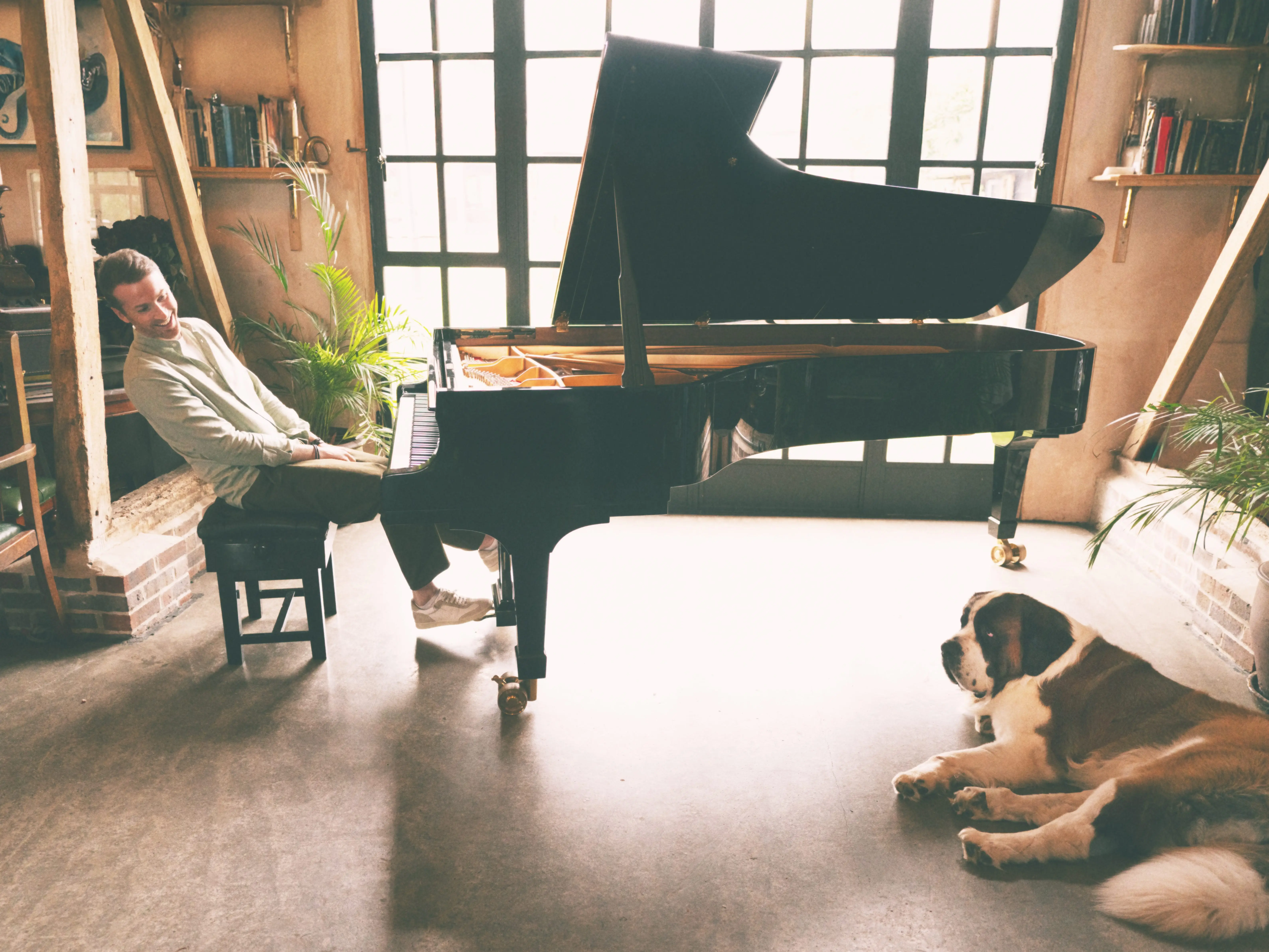 A man sitting at a grand piano.