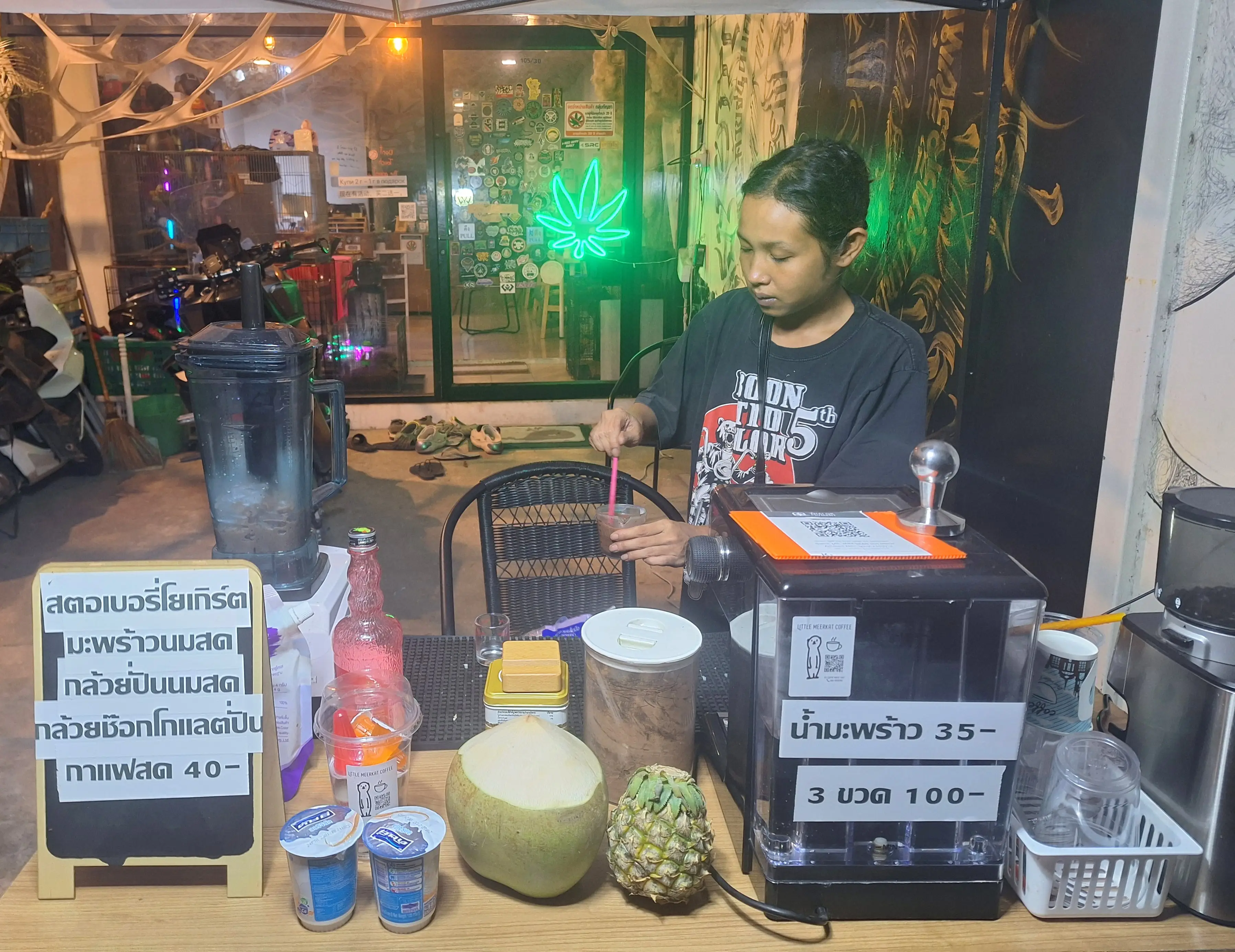 Woman sending coconuts and drinks in Thailand.