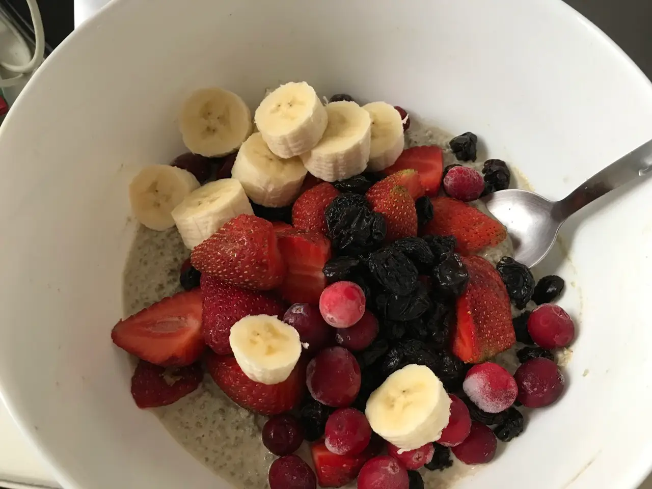 Coconut chia seed pudding with berries and bananas