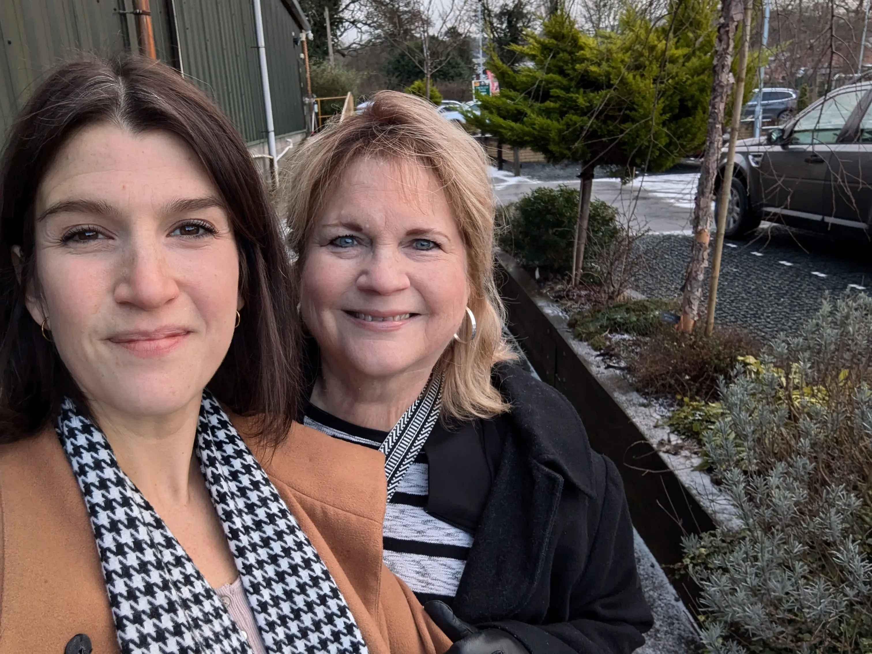 Mom and daughter posing for photo