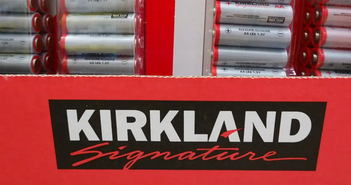 I compared Costco shopping carts of Kirkland Signature products and brand names. The price differences surprised me.